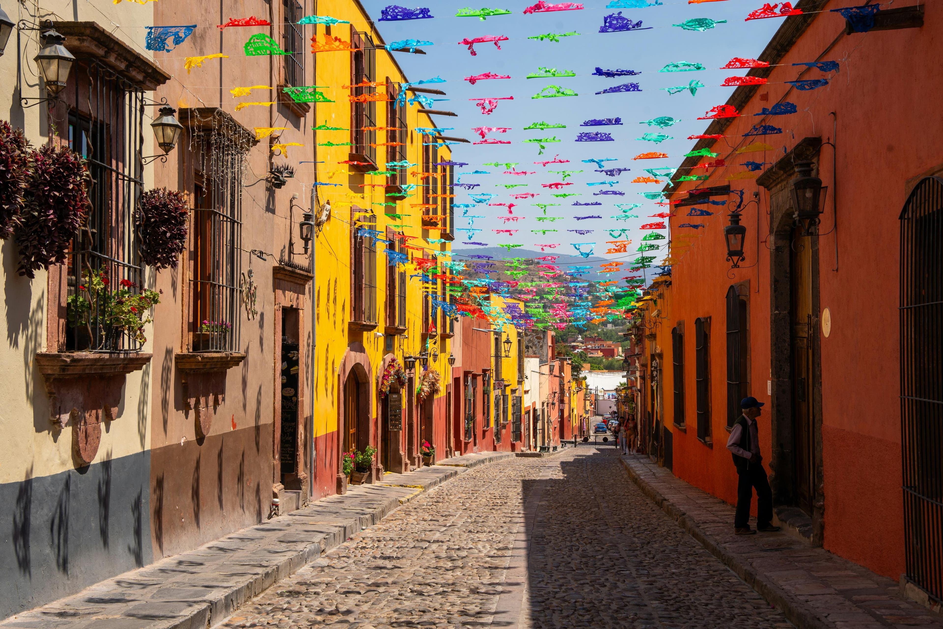Colorful street with papel picado banners in San Miguel de Allende
