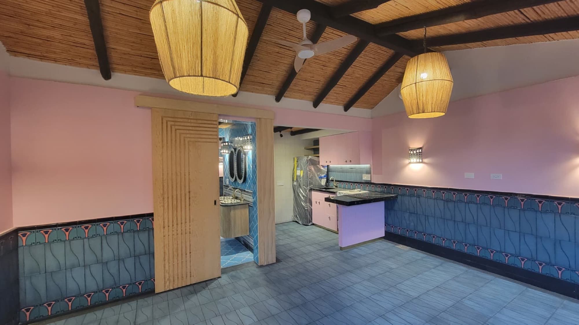 The remodeled first unit at Queerhaven, with a new kitchen beneath the original carrizo ceiling