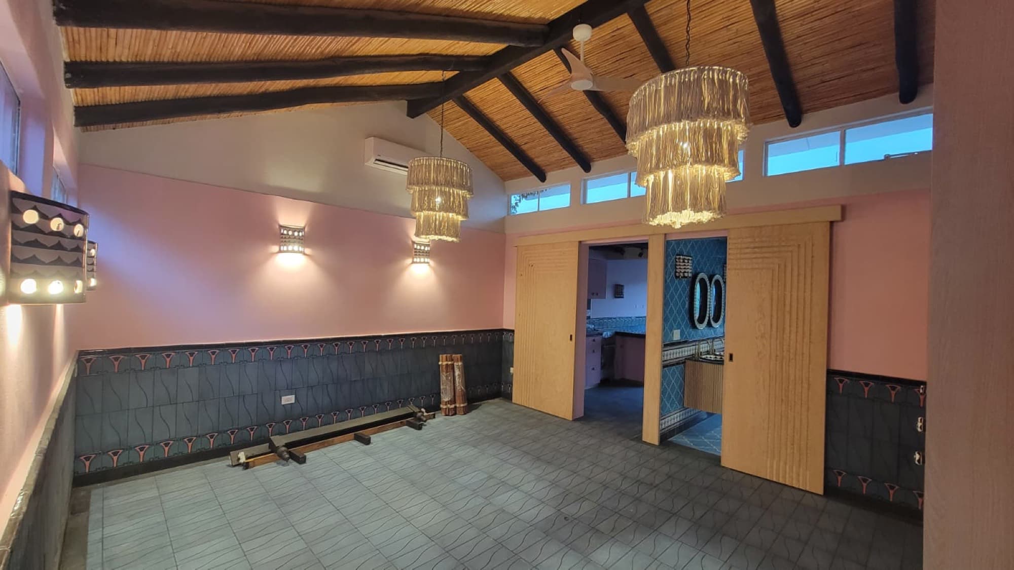 A remodeled reception room at Queerhaven with restored carrizo ceilings