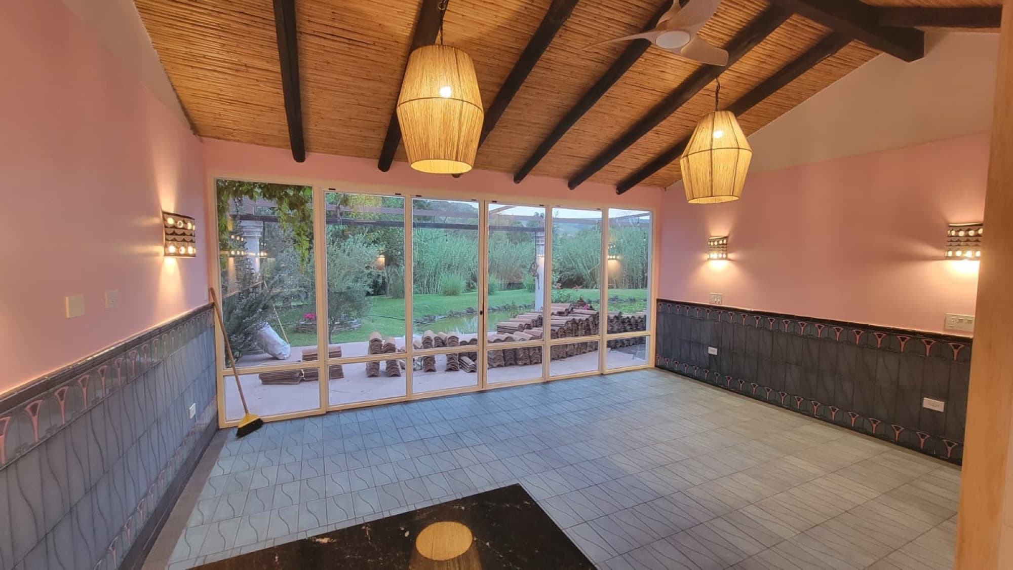 A remodeled room at Queerhaven opening to the garden and pond