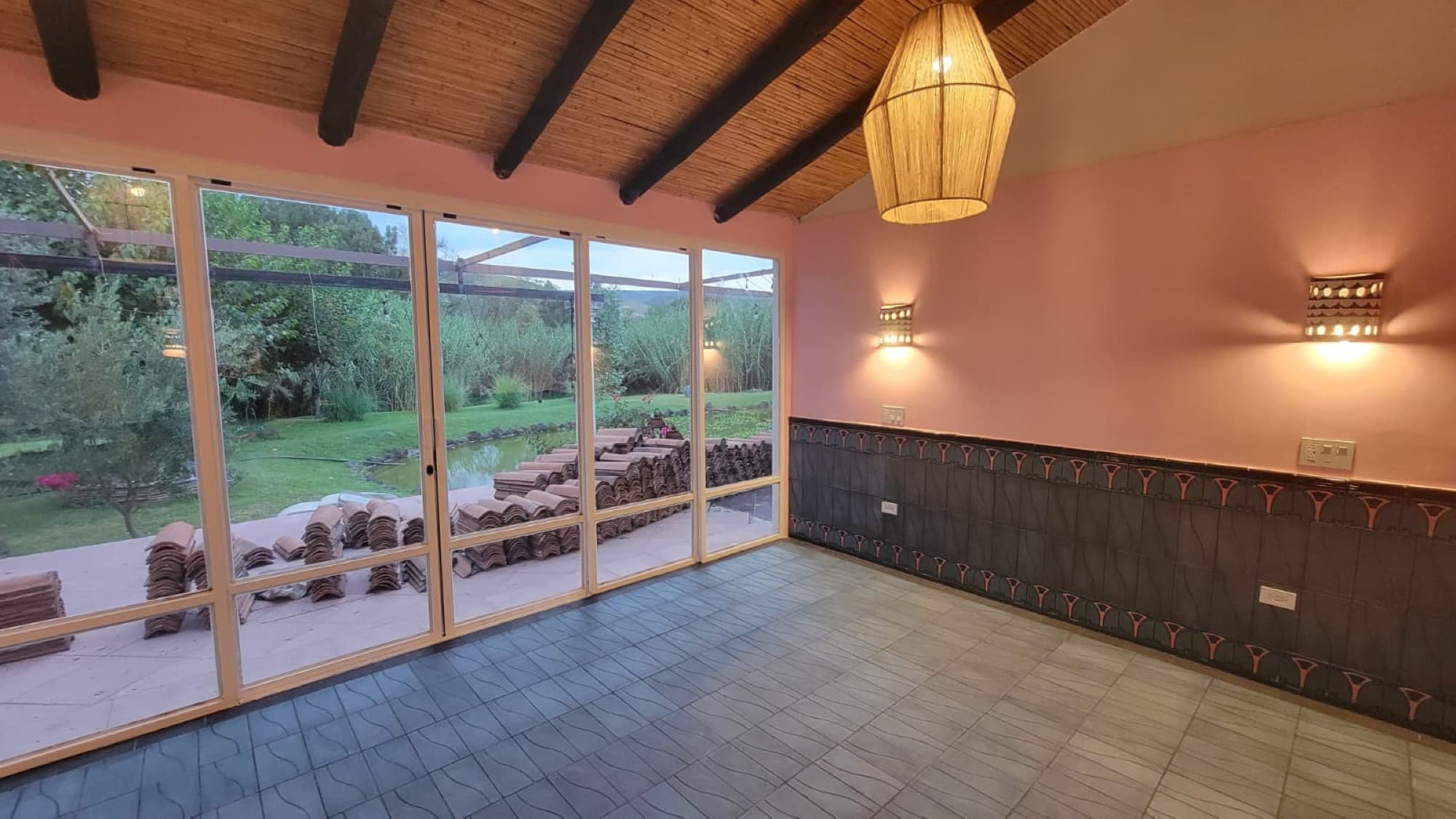 A remodeled room at Queerhaven with garden and pond views