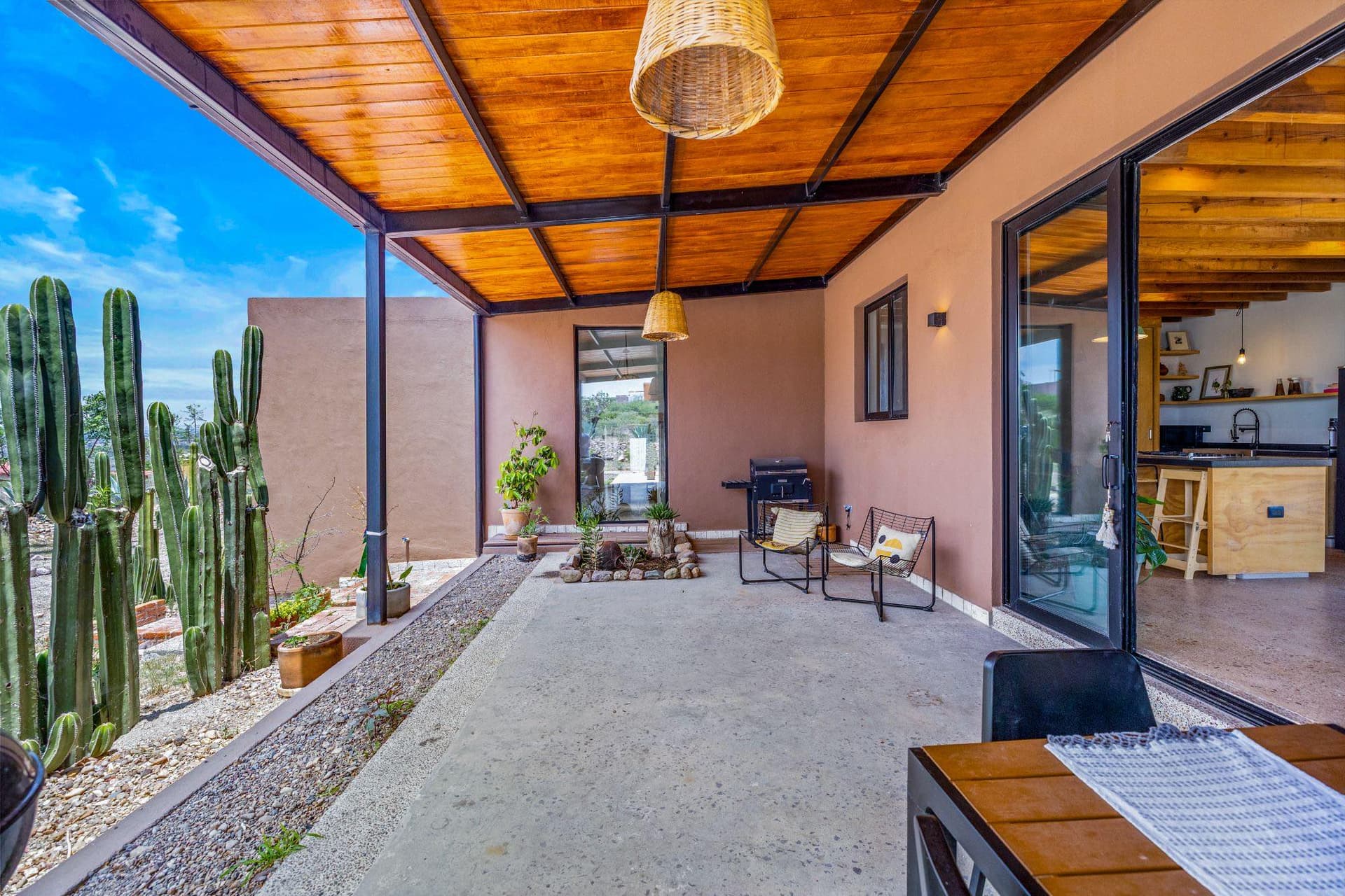 Wood pergola and outdoor terrace at Villa Jacaranda