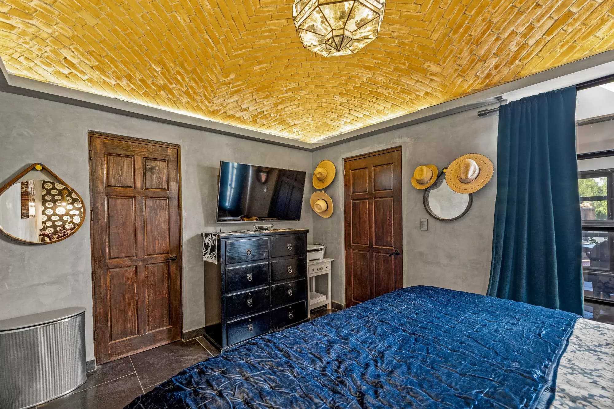 Penthouse Quebrada — San Miguel de Allende Centro, San Miguel de Allende — photo 15 — artisanal bedroom with golden woven ceiling