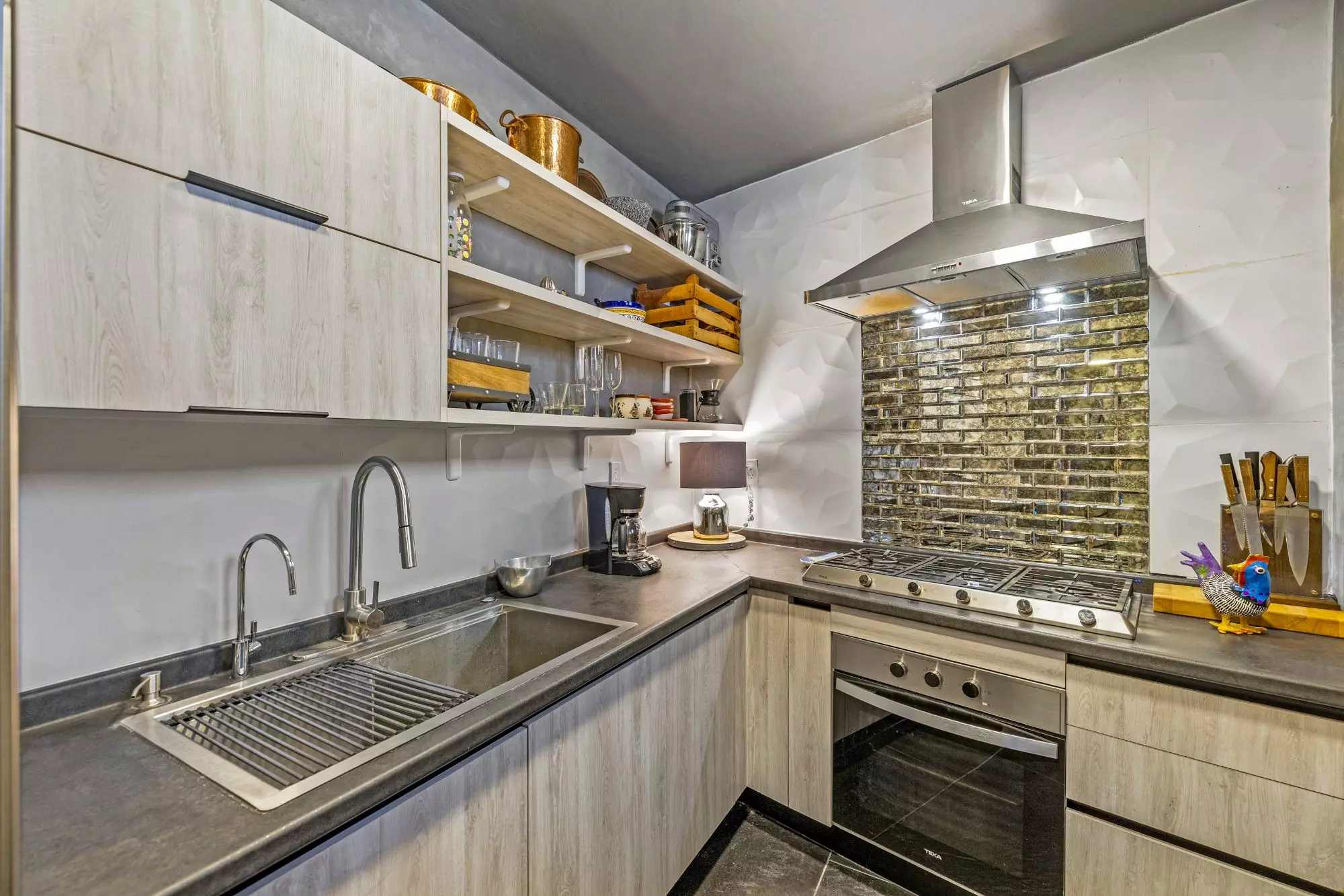 Penthouse Quebrada — San Miguel de Allende Centro, San Miguel de Allende — photo 11 — contemporary chef's kitchen, gleaming sophistication