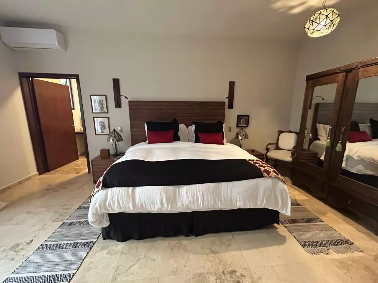 Premium Country Estate Sosnabar — Sosnabar, San Miguel de Allende — photo 11 — elegant master suite with warm sunlight