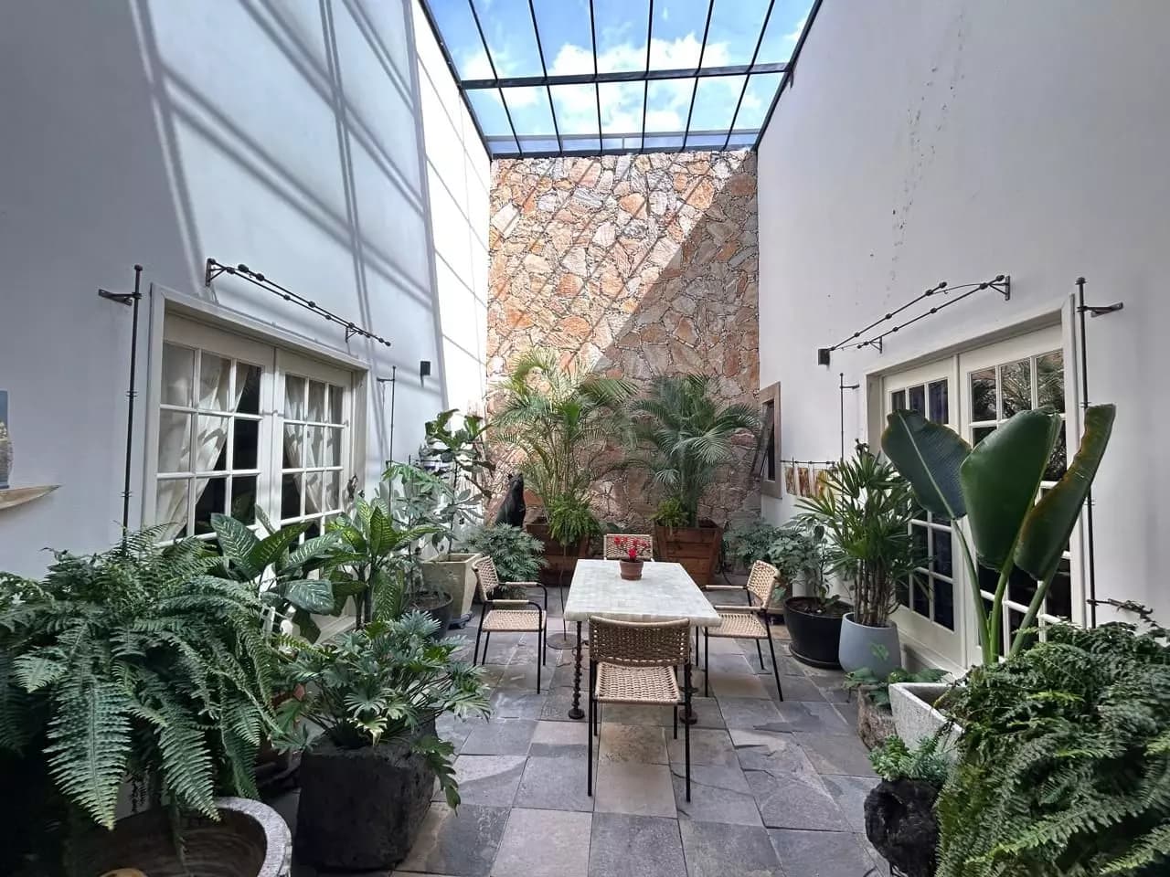 Premium Country Estate Sosnabar — Sosnabar, San Miguel de Allende — photo 10 — luminous courtyard with soaring glass ceiling