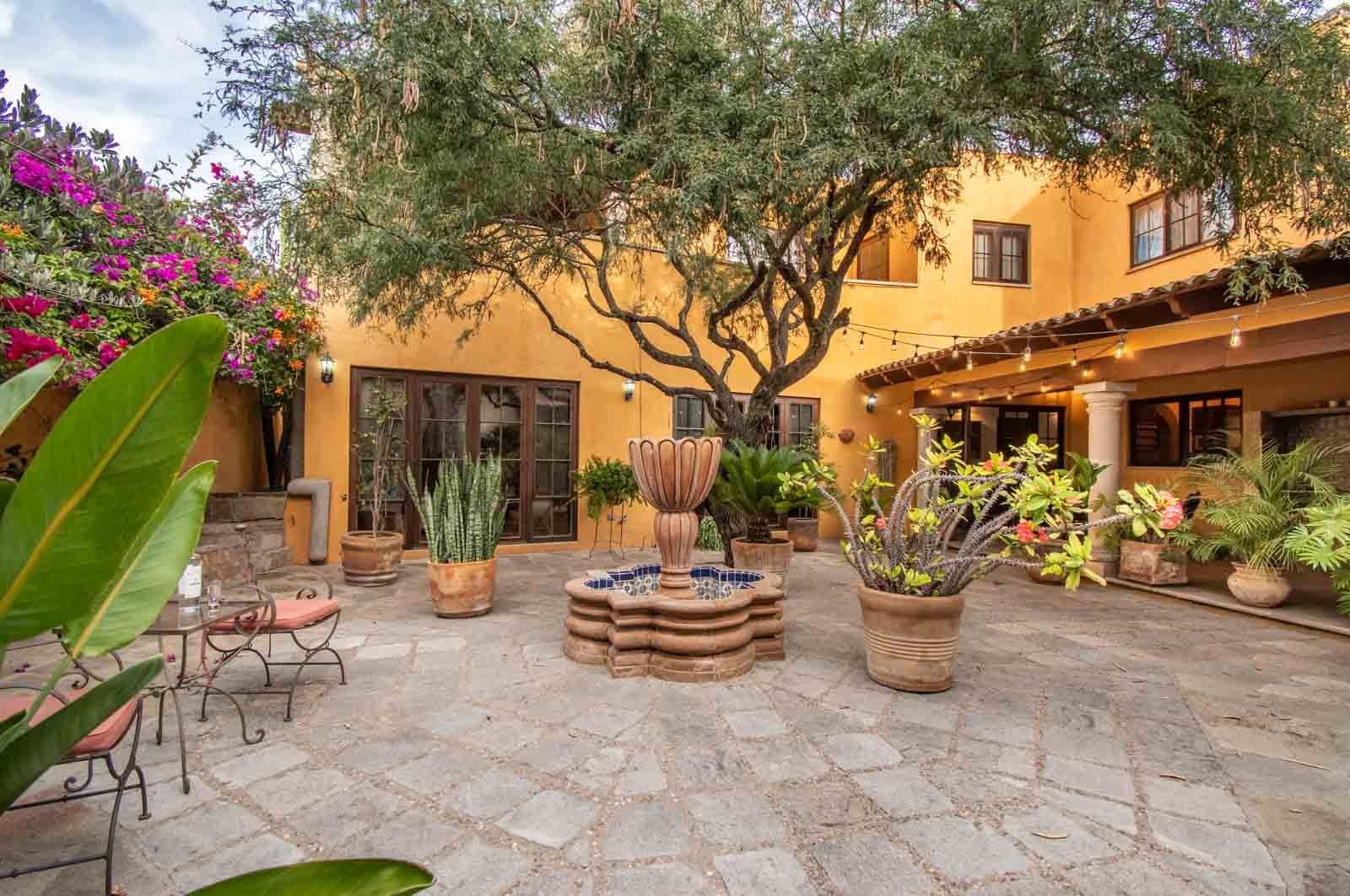 Casa San Miguel 11 — El Paraiso, San Miguel de Allende — photo 16 — enchanting courtyard, mature trees, vibrant blooms