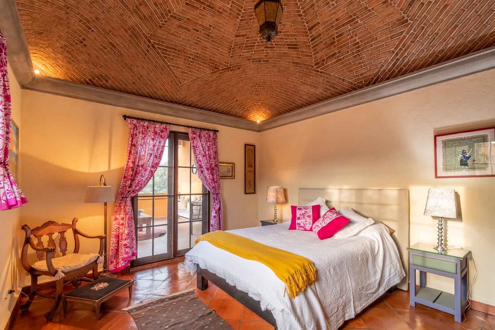 Casa San Miguel 11 — El Paraiso, San Miguel de Allende — photo 21 — serene colonial bedroom, golden light flooded