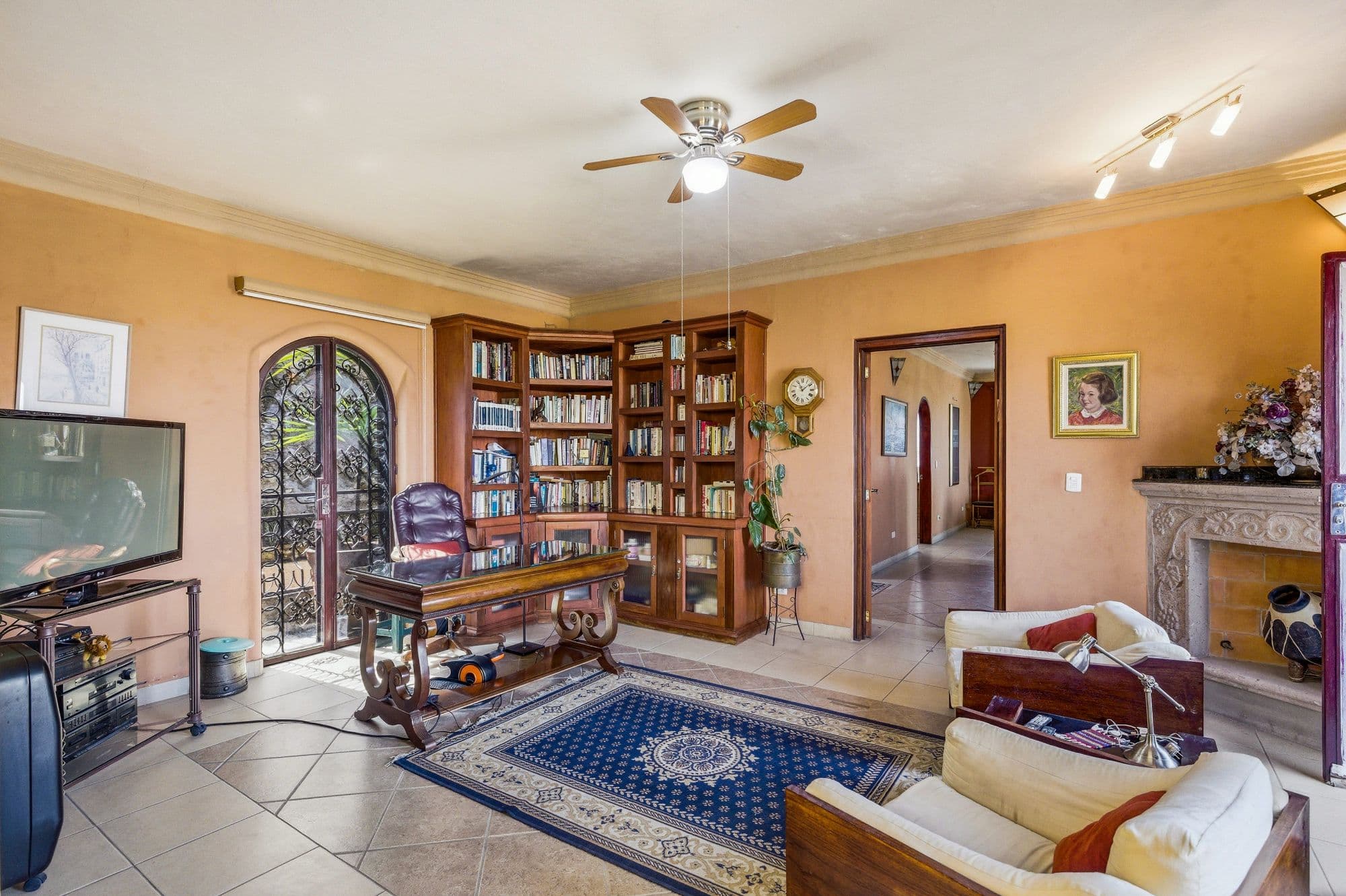Casa Arie — Caracol, San Miguel de Allende — photo 9 — sunlit library room, elegant wood craftsmanship