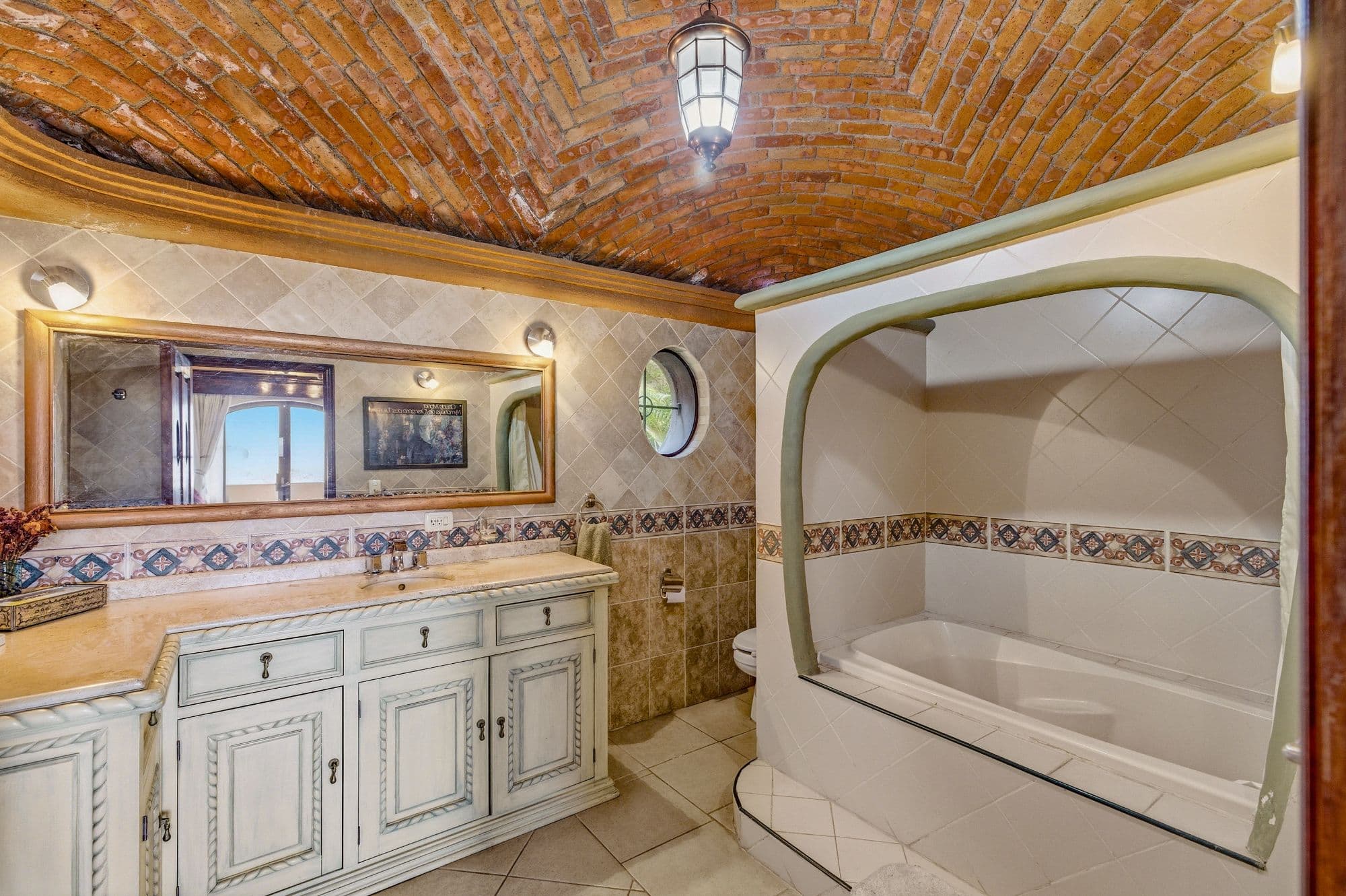 Casa Arie — Caracol, San Miguel de Allende — photo 8 — rustic-luxe master bath, soaring barrel ceiling
