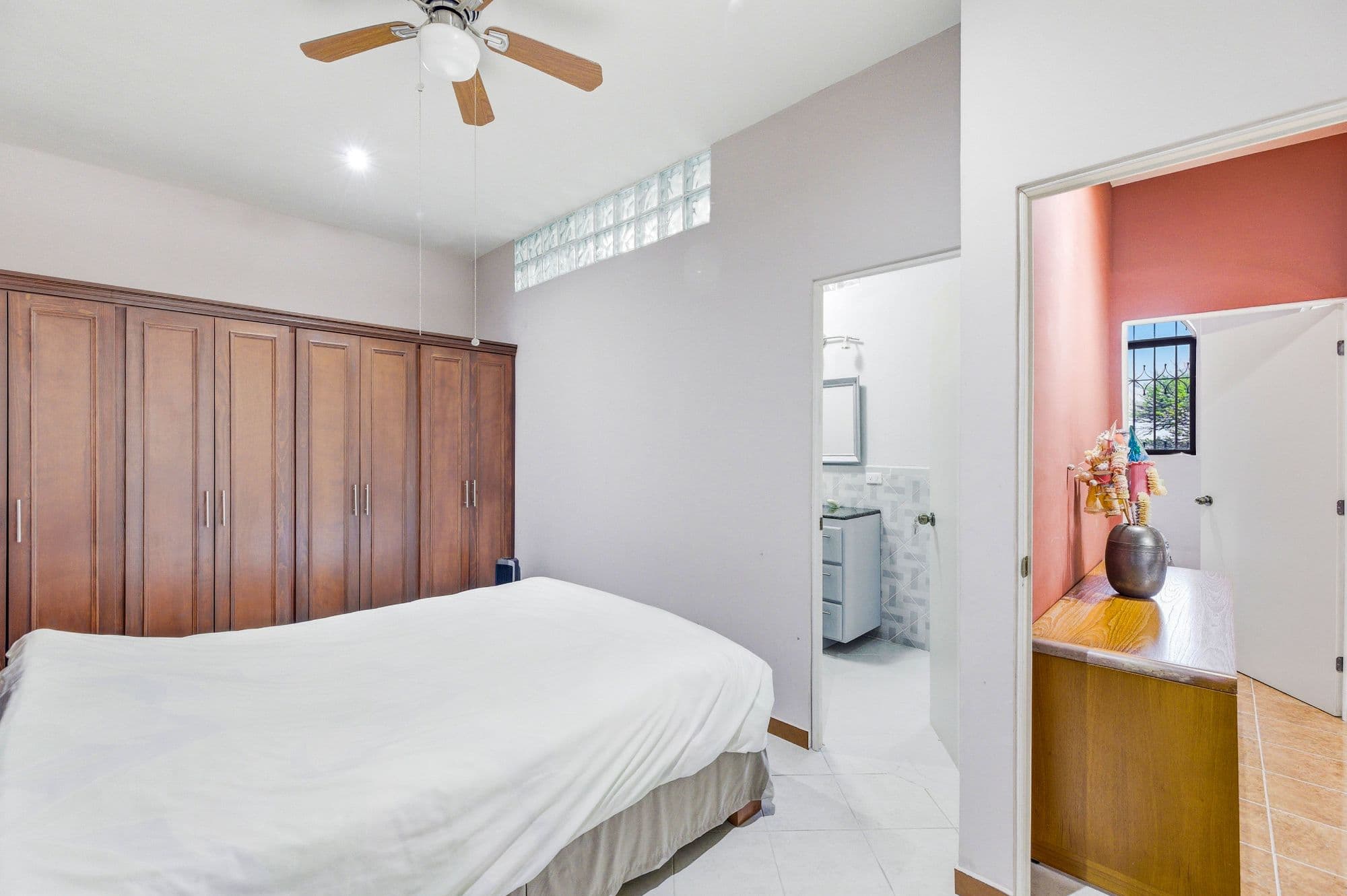 Casa Arie — Caracol, San Miguel de Allende — photo 22 — serene primary suite with elegant wood cabinetry