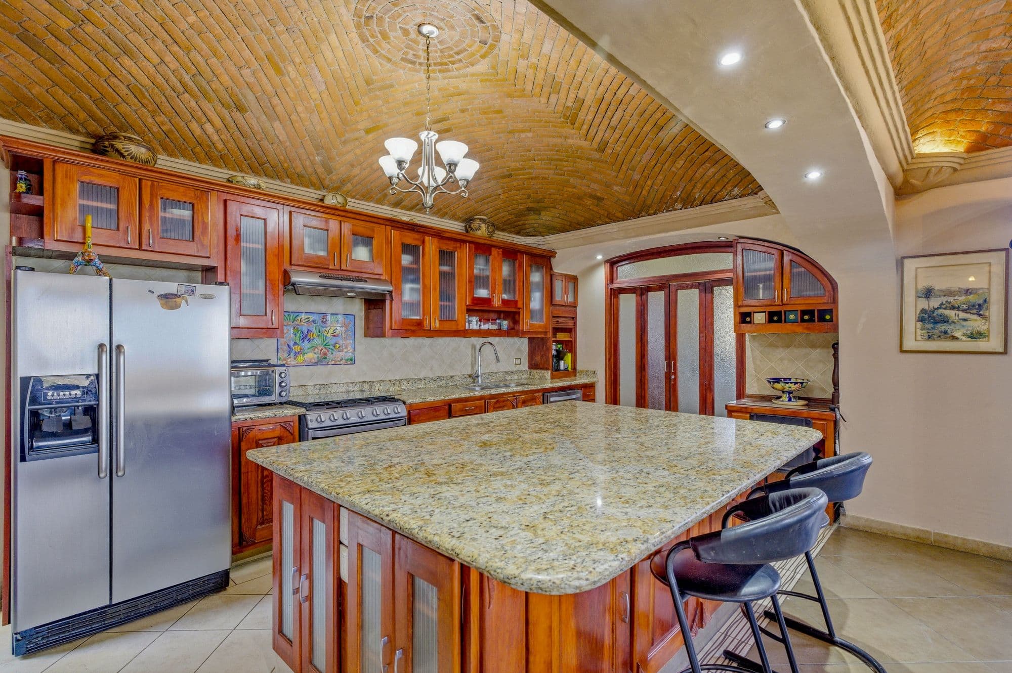 Casa Arie — Caracol, San Miguel de Allende — photo 3 — sophisticated kitchen, warm wood elegance
