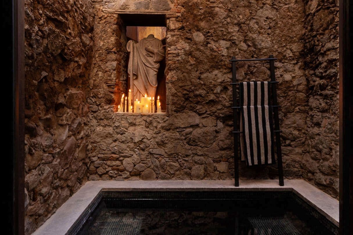 Casa Bomboti — Centro, San Miguel de Allende — photo 12 — candlelit courtyard with sculptural charm