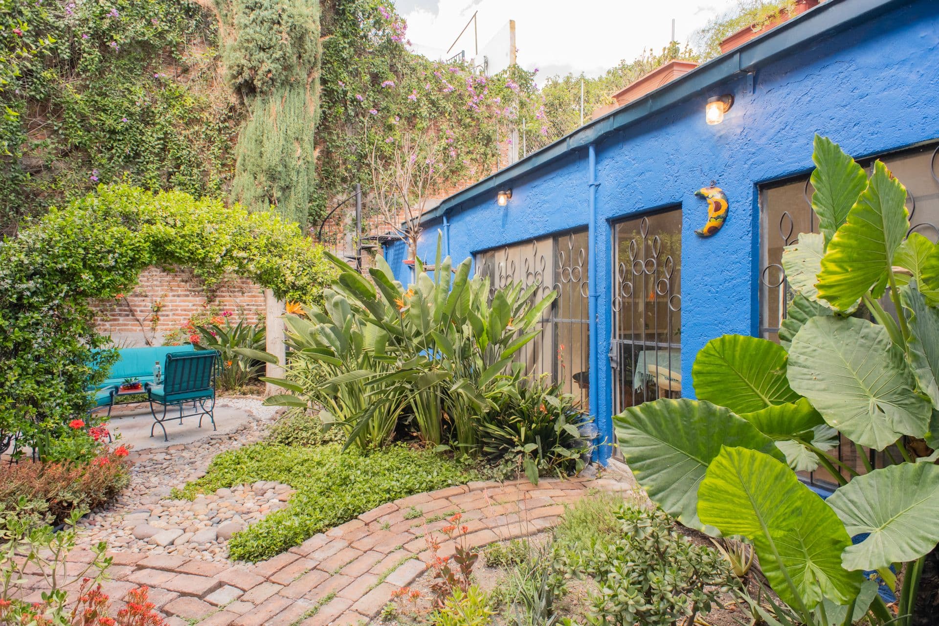Casa Santuario — San Antonio, San Miguel de Allende — photo 14 — vibrant courtyard, lush botanical garden