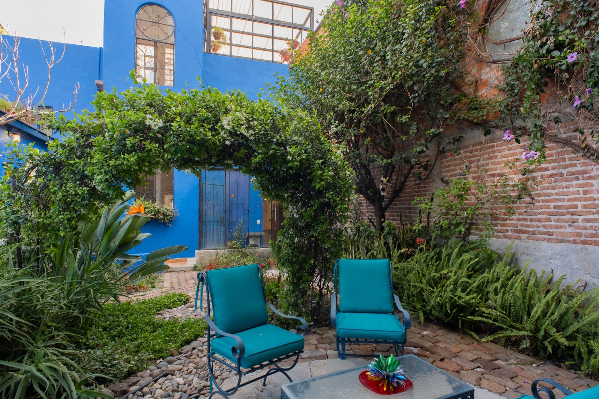 Casa Santuario — San Antonio, San Miguel de Allende — photo 11 — vibrant courtyard oasis, lush gardens blooming