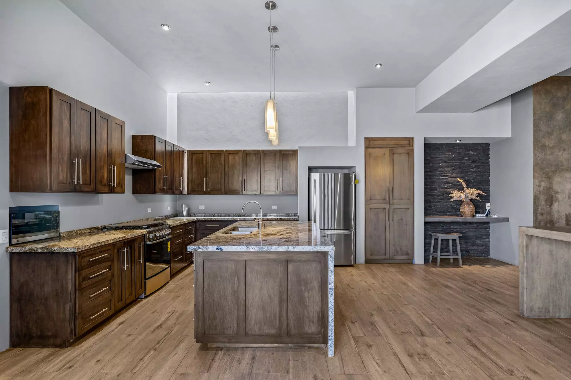 Casa San Uriel — El Paraiso, San Miguel de Allende — photo 13 — contemporary luxury kitchen with soaring ceilings