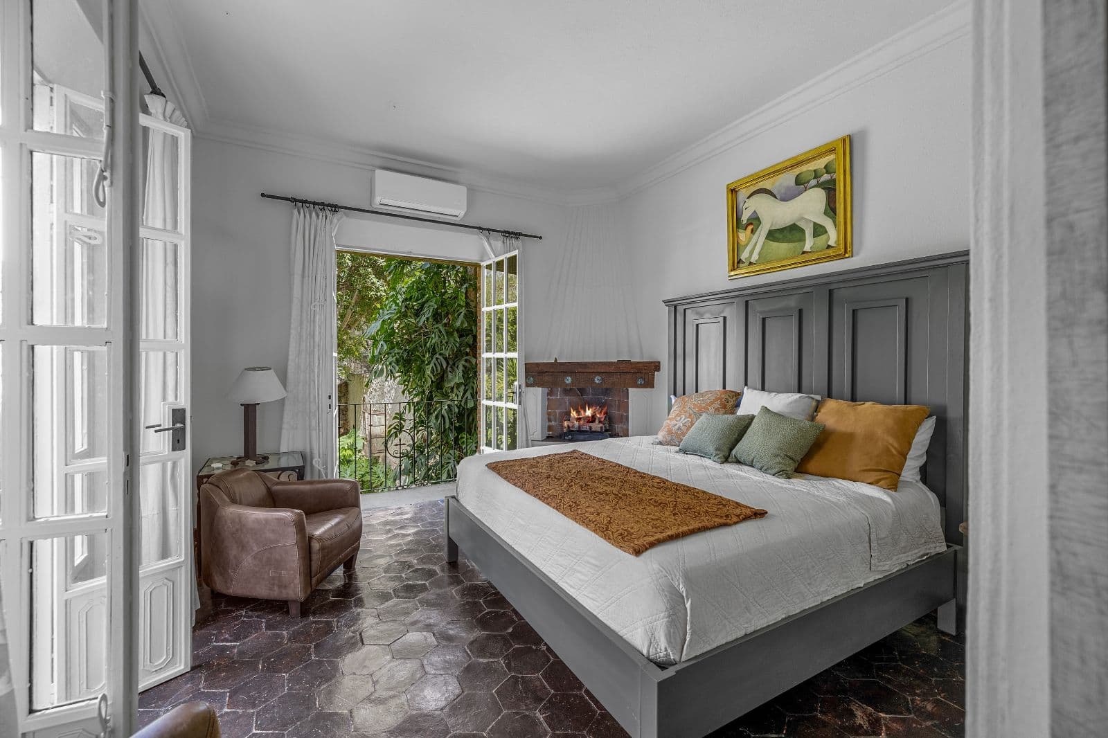 Casa de La Soñadora — Centro, San Miguel de Allende — photo 11 — luxurious master suite, garden views, fireplace