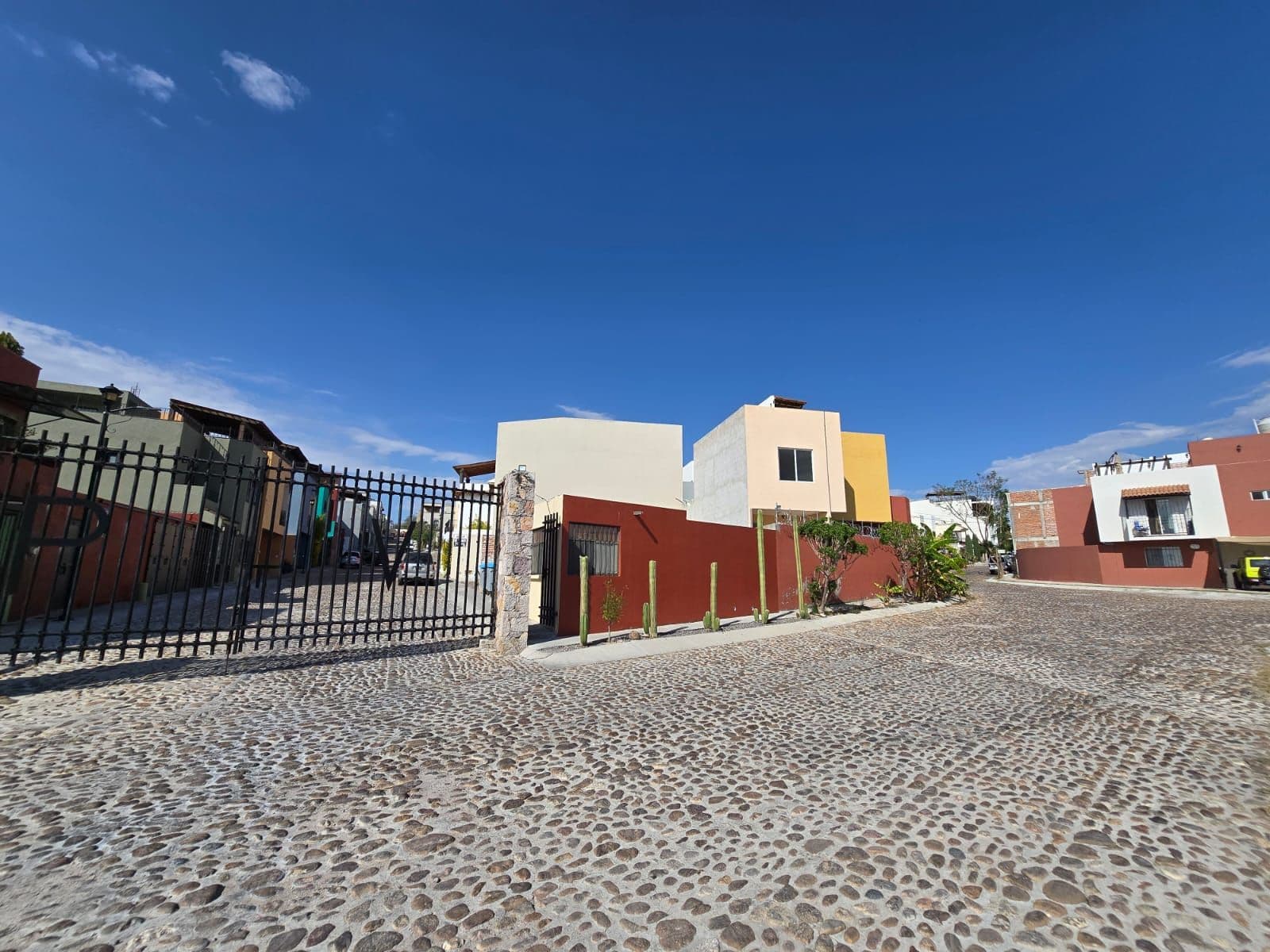 Privada del Valle Lote — Las Brisas, San Miguel de Allende — photo 3 — vibrant contemporary compound, sun-drenched streetscape