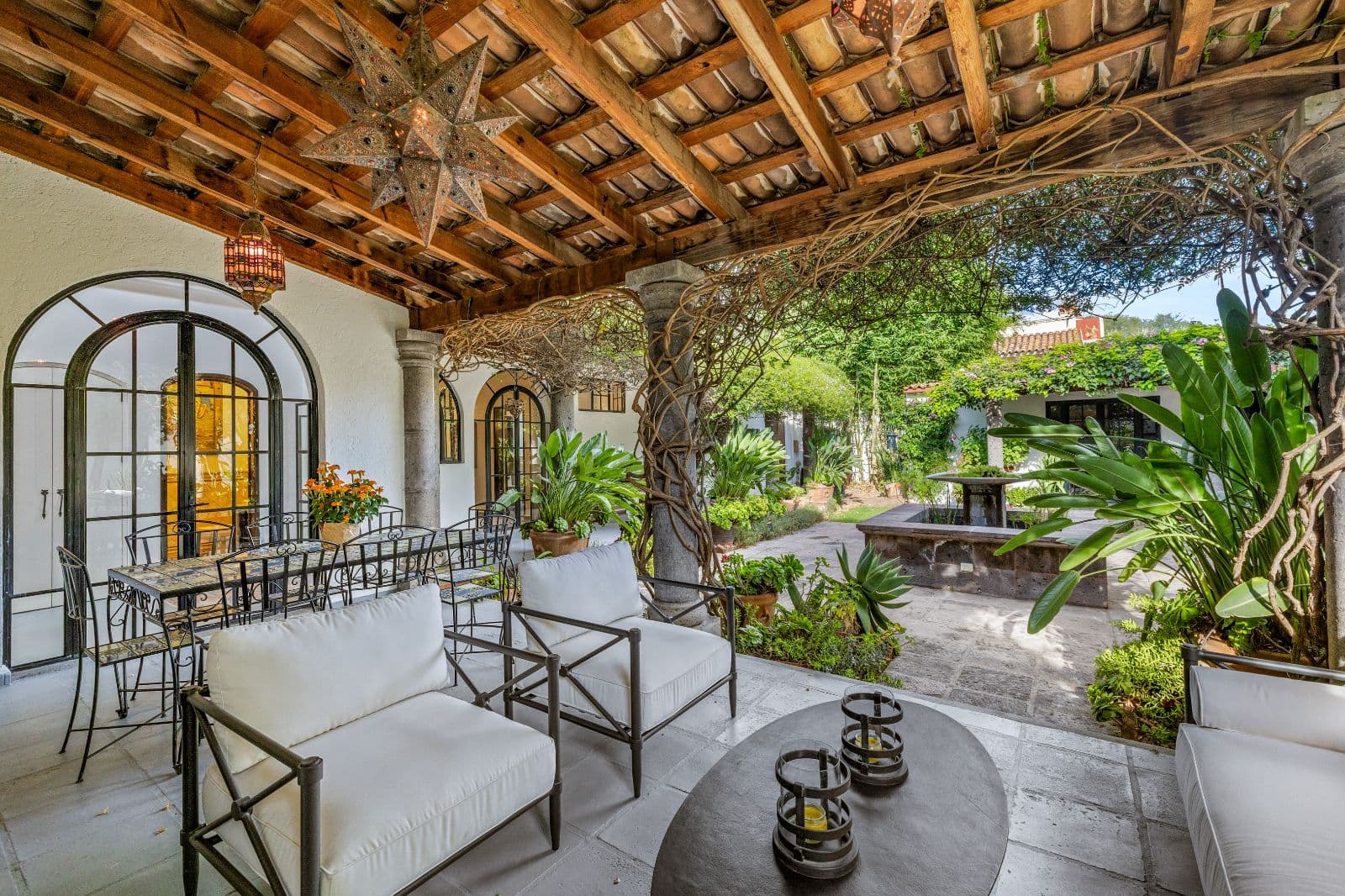 Casa CurVale — Villa de los Frailes, San Miguel de Allende — photo 21 — enchanting courtyard with rustic wooden pergola