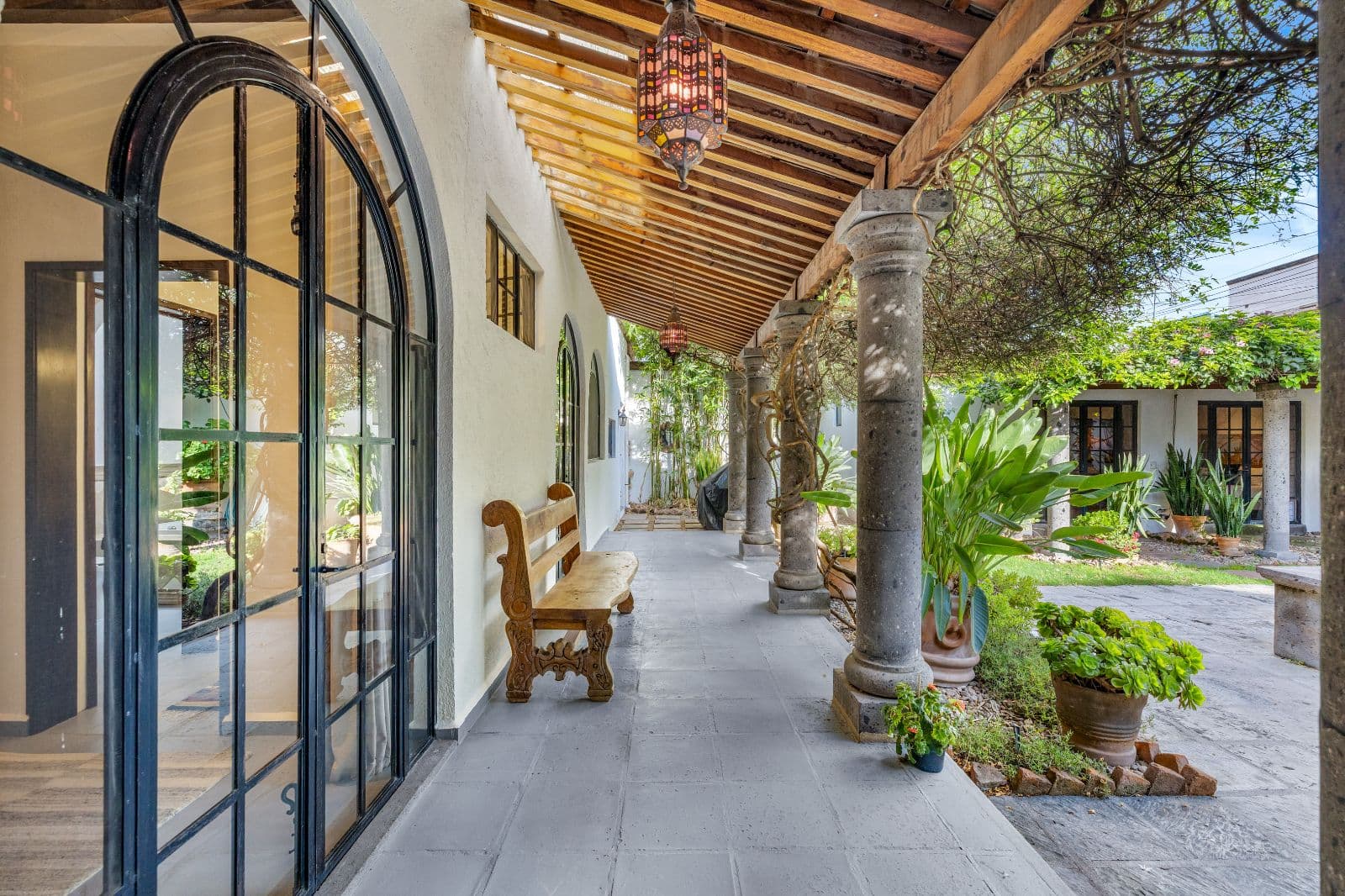 Casa CurVale — Villa de los Frailes, San Miguel de Allende — photo 17 — elegant covered veranda, mature architectural charm