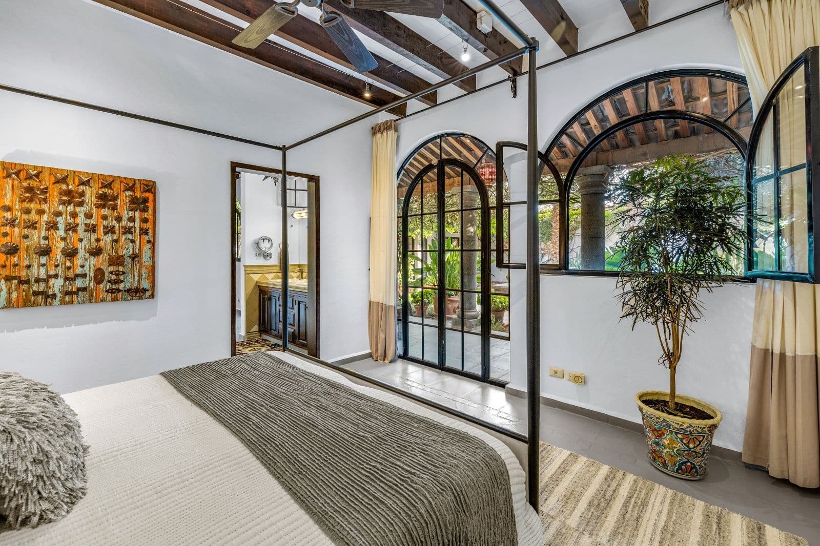 Casa CurVale — Villa de los Frailes, San Miguel de Allende — photo 24 — sophisticated bedroom with garden views