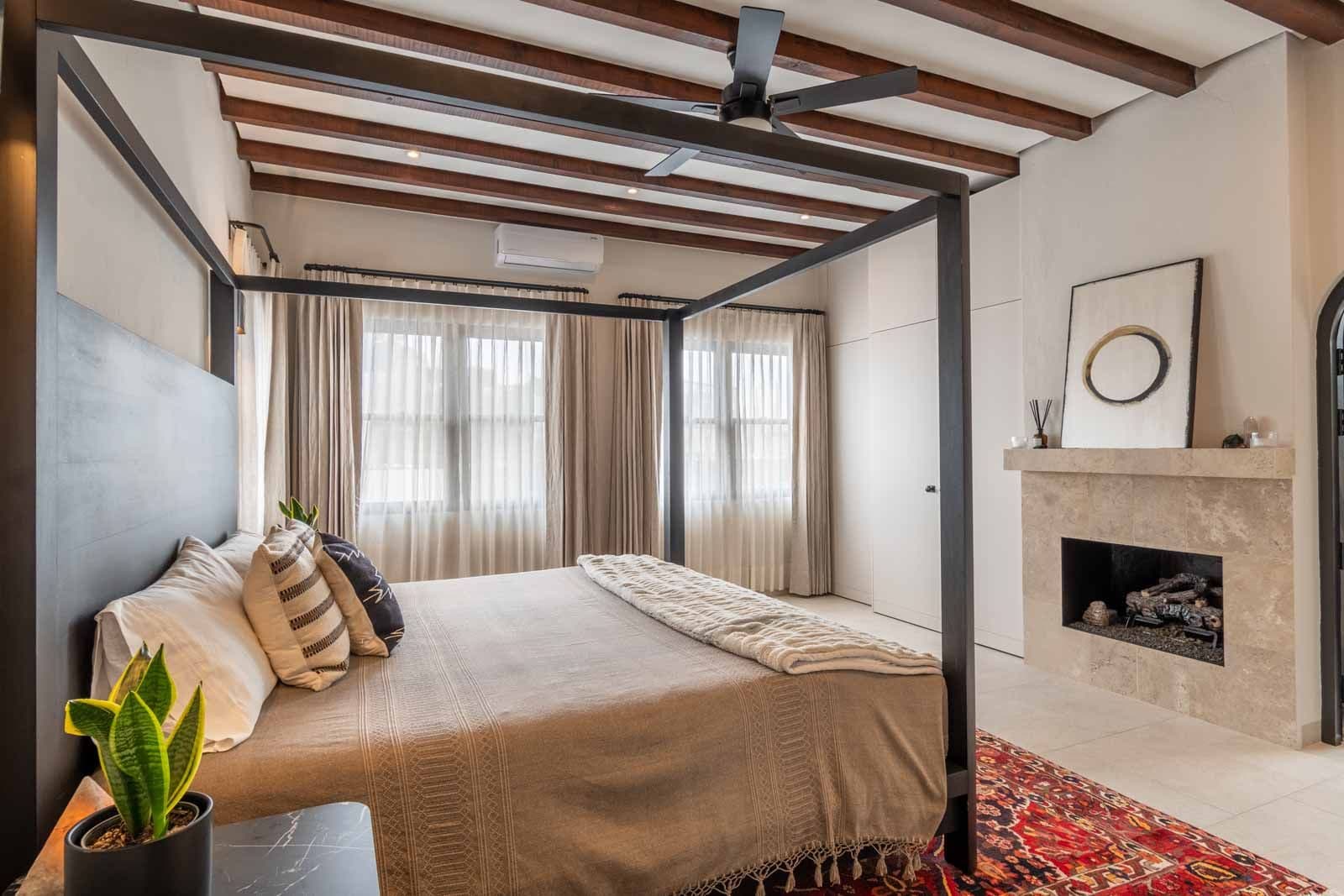 Casa de Luz — Ojo de Agua, San Miguel de Allende — photo 15 — luxurious canopy bed, fireplace ambiance