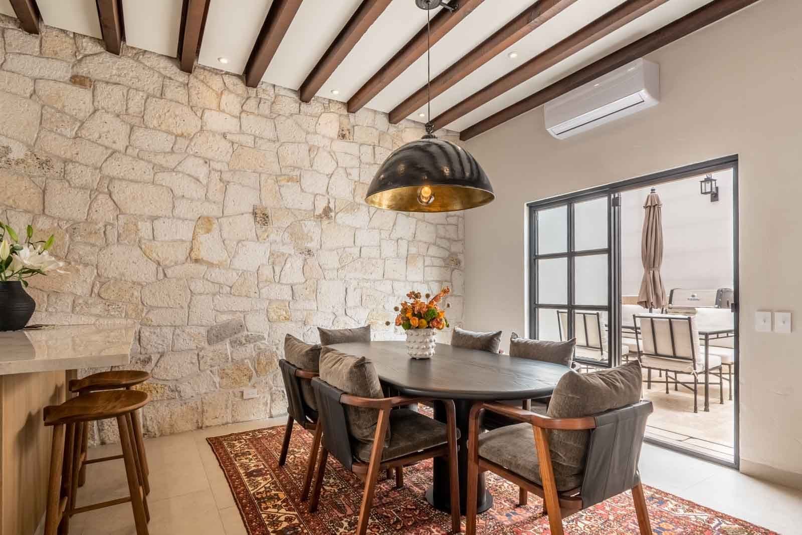 Casa de Luz — Ojo de Agua, San Miguel de Allende — photo 2 — elegant dining with exposed stone elegance