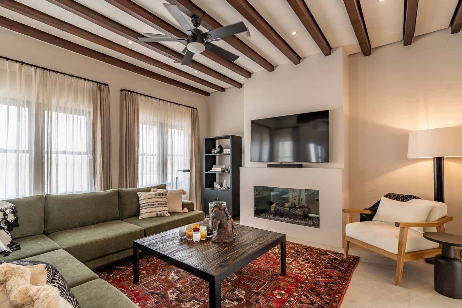 Casa de Luz — Ojo de Agua, San Miguel de Allende — photo 3 — contemporary living room, architectural beams, fireplace warmth