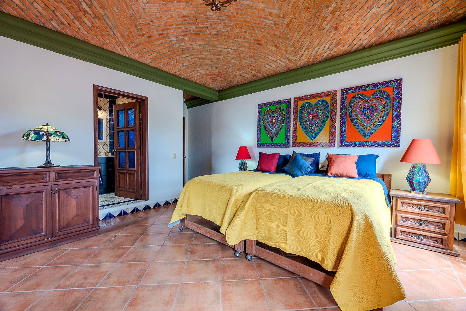 Casa Colorida — Villa de los Frailes, San Miguel de Allende — photo 18 — vibrant colonial bedroom with soaring brick vaults