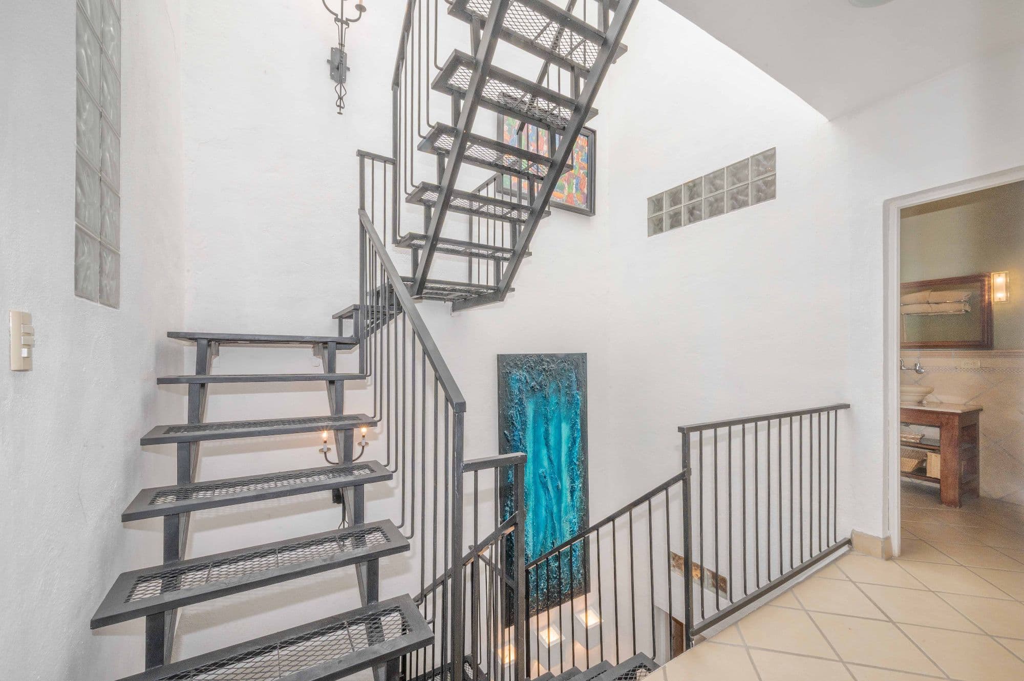 Casa Azul Escondida — San Antonio, San Miguel de Allende — photo 10 — modern industrial staircase, soaring ceilings