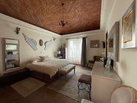 CASA AGAVE — Villa de los Frailes, San Miguel de Allende — photo 25 — sophisticated bedroom, rustic brick ceiling elegance