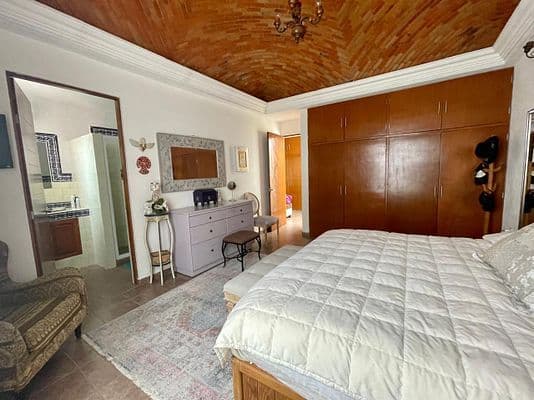 CASA AGAVE — Villa de los Frailes, San Miguel de Allende — photo 24 — spacious master suite, warm wood details