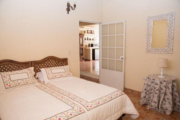 CASA AGAVE — Villa de los Frailes, San Miguel de Allende — photo 5 — serene bedroom with charming architectural details