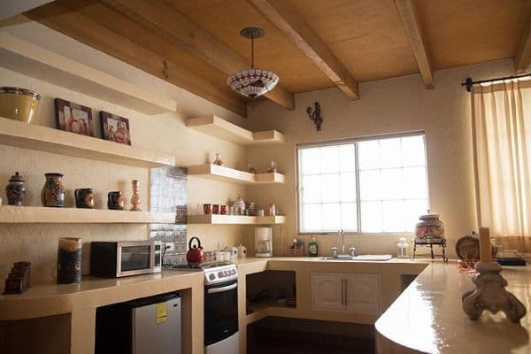 CASA AGAVE — Villa de los Frailes, San Miguel de Allende — photo 6 — radiant kitchen with rustic architectural charm