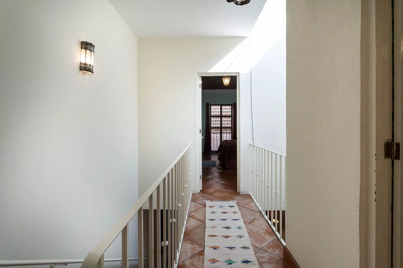 Casita Guadiana — Guadiana, San Miguel de Allende — photo 15 — bright transitional gallery with soaring light