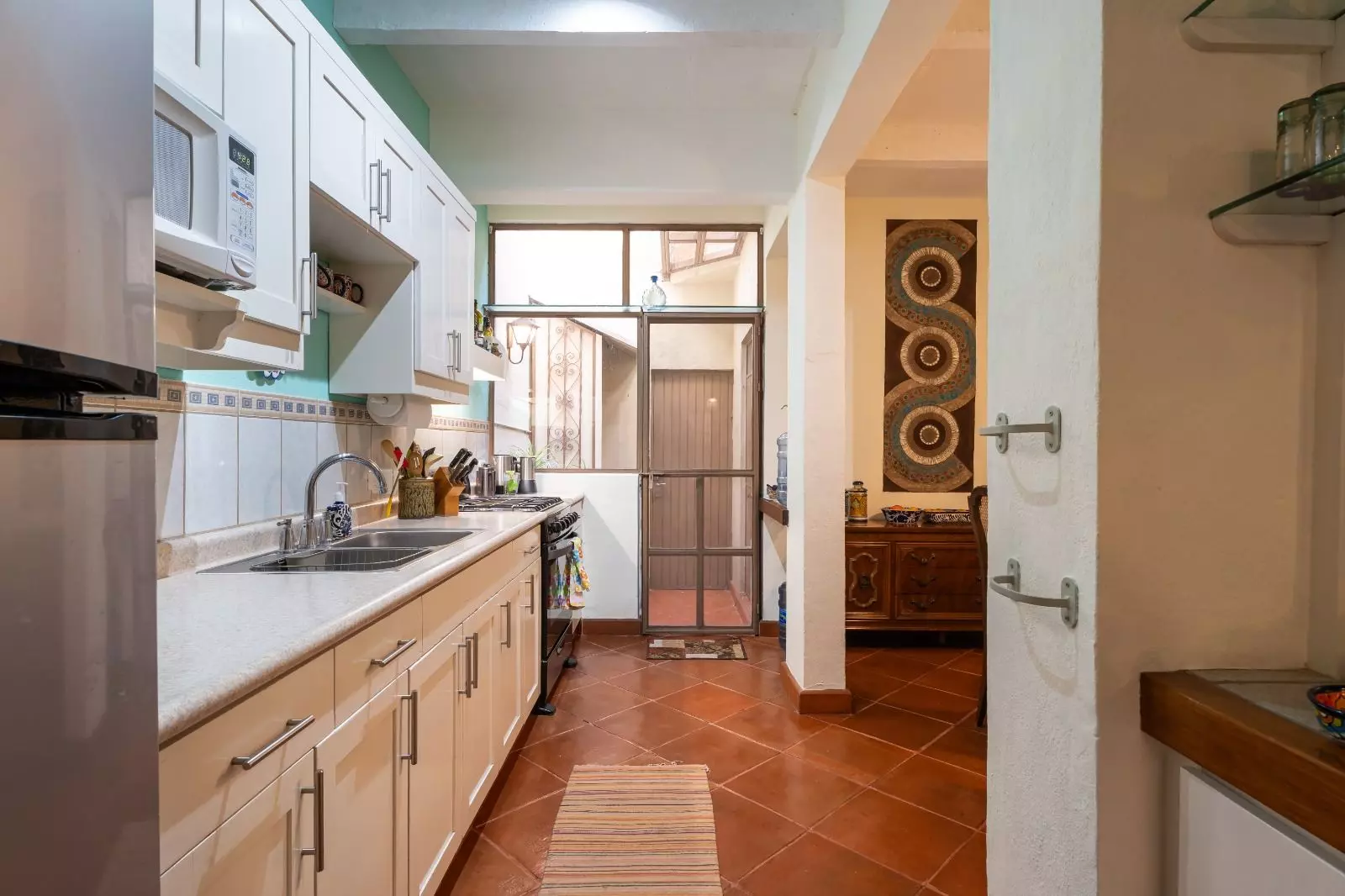 Casita Guadiana — Guadiana, San Miguel de Allende — photo 6 — charming galley kitchen, authentic mexican tiles