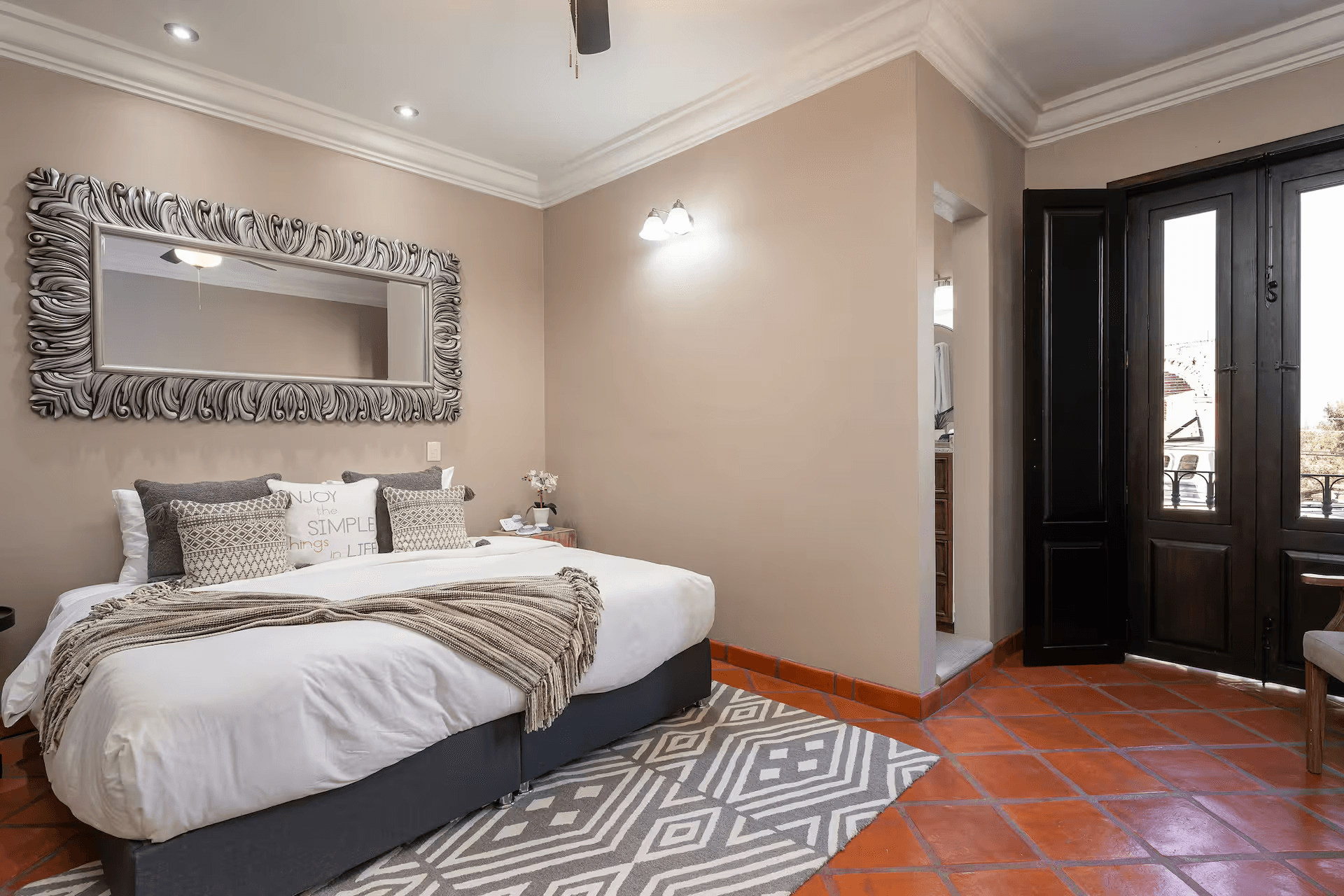 Casa Mimosa — San Antonio, San Miguel de Allende — photo 13 — sophisticated master suite, stunning terracotta floors