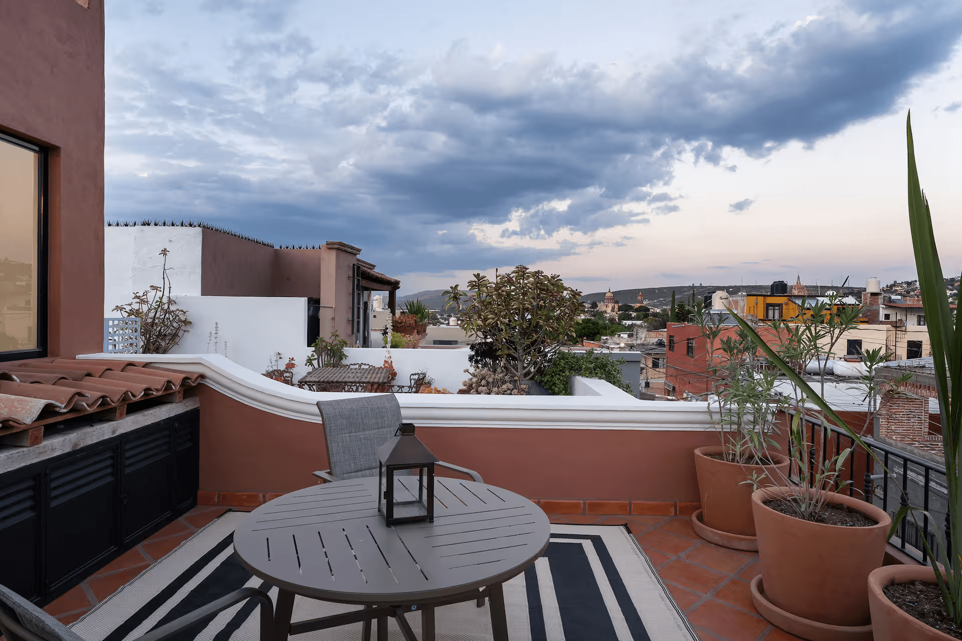 Casa Mimosa — San Antonio, San Miguel de Allende — photo 25 — panoramic rooftop terrace, dramatic sky views