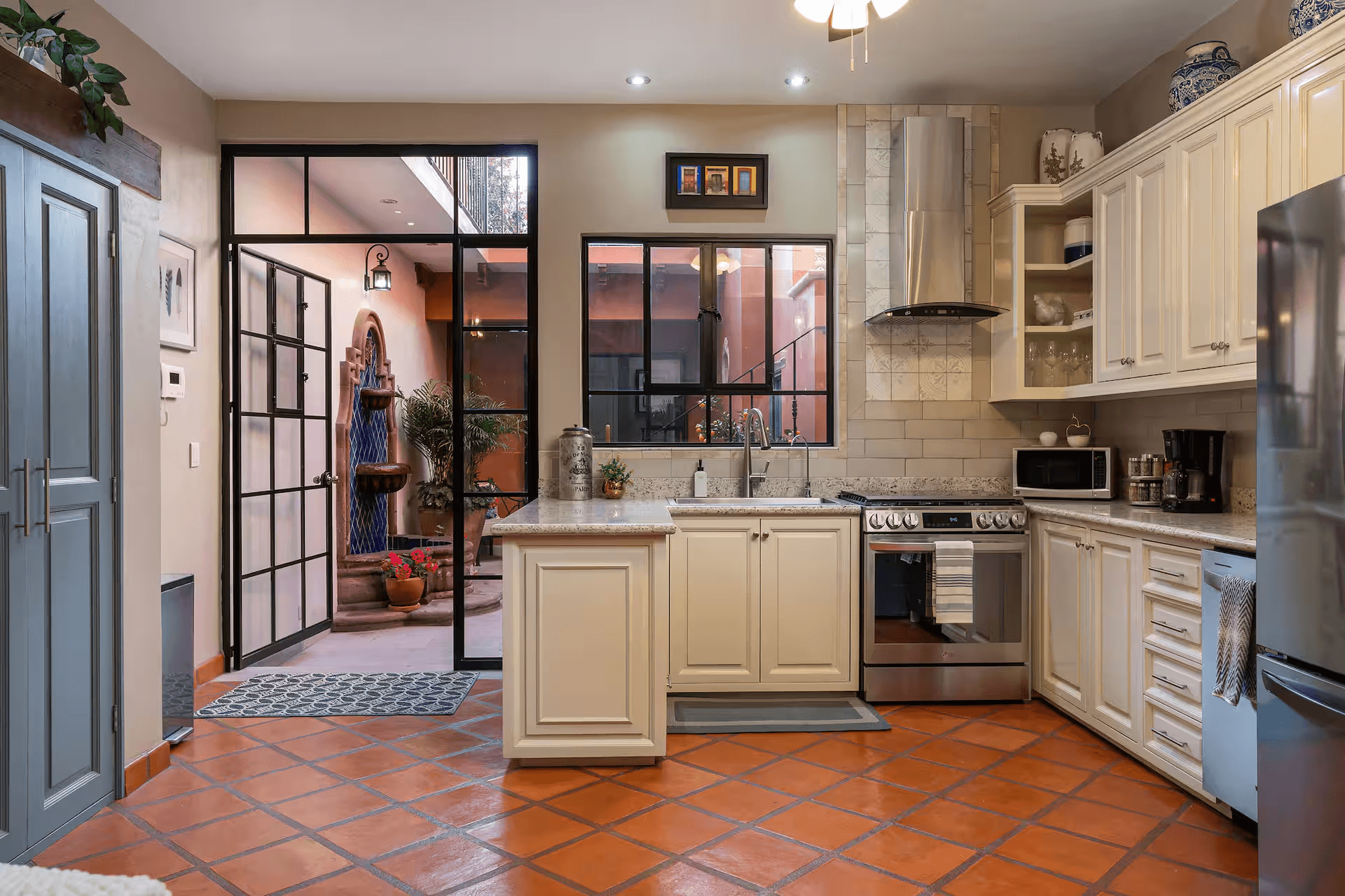 Casa Mimosa — San Antonio, San Miguel de Allende — photo 5 — elegant colonial kitchen with sunset views