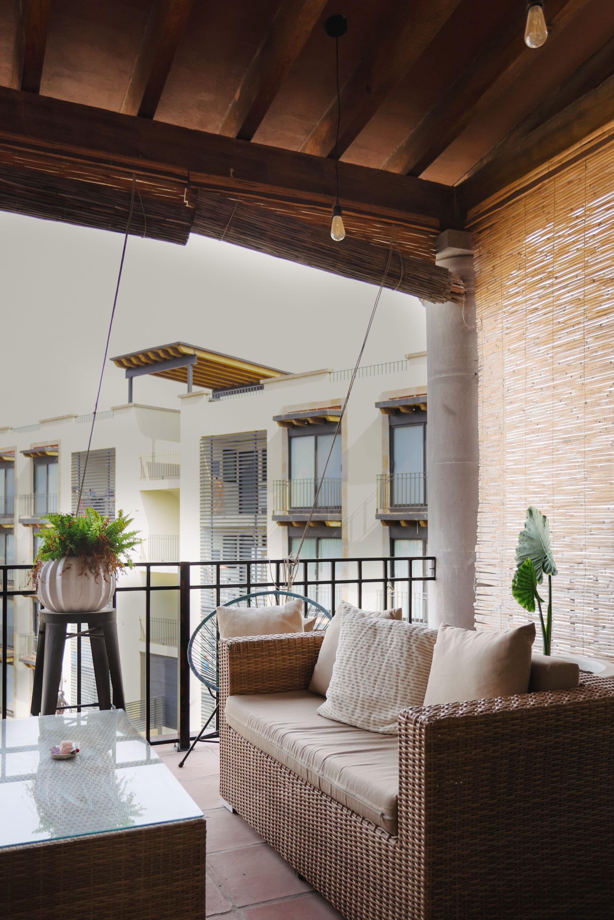 El Milagro Rooftop Apartment — San Miguel de Allende Centro, San Miguel de Allende — photo 4 — sophisticated covered terrace with architectural warmth