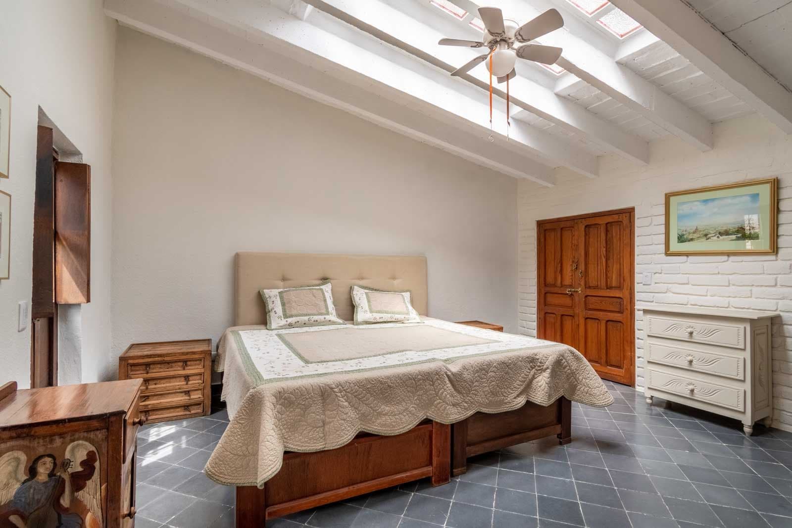 Casa Quebrada — Centro, San Miguel de Allende — photo 5 — sun-drenched bedroom, rustic wooden beams