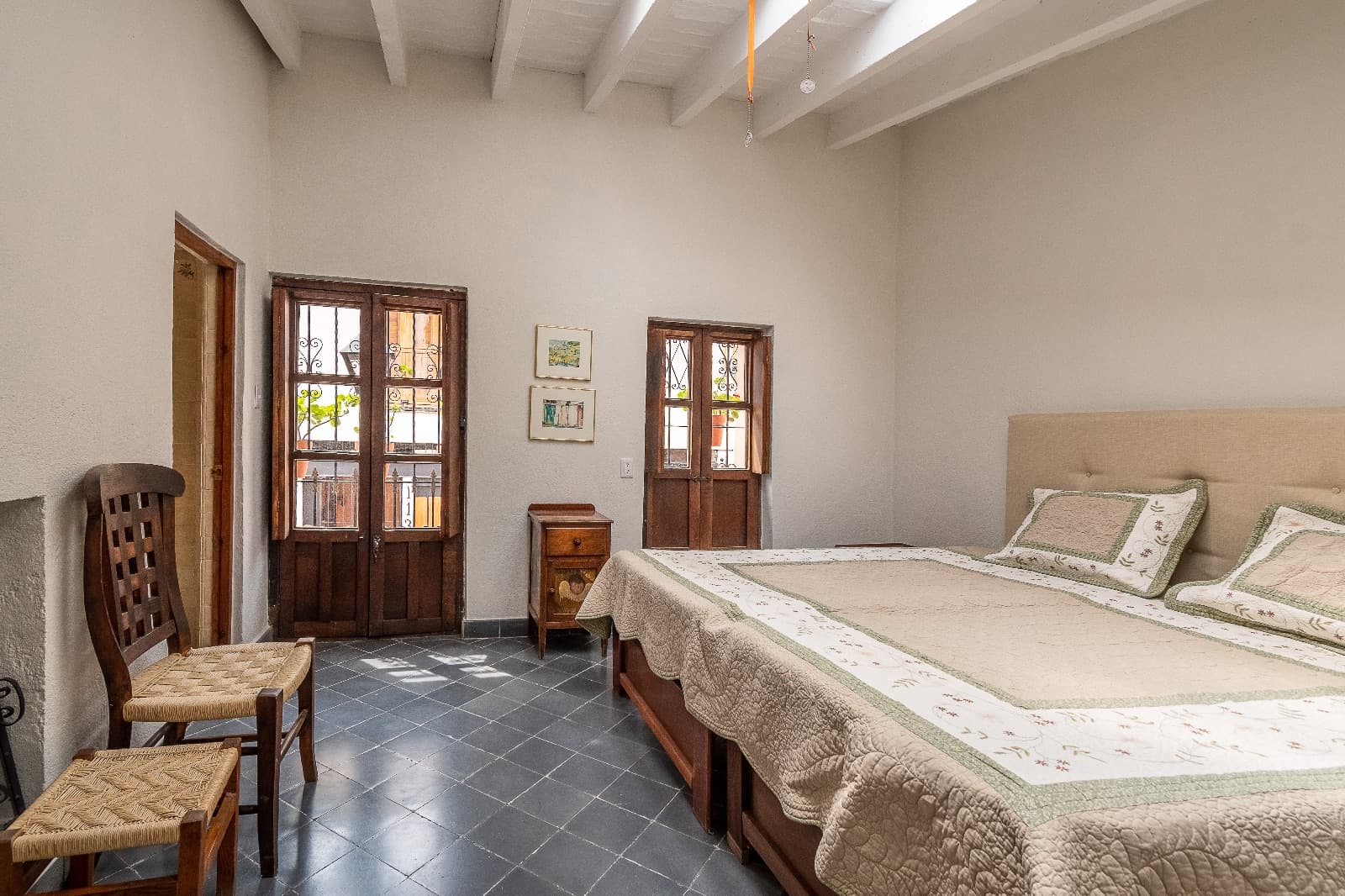 Casa 54 — Centro, San Miguel de Allende — photo 10 — charming colonial bedroom with abundant light