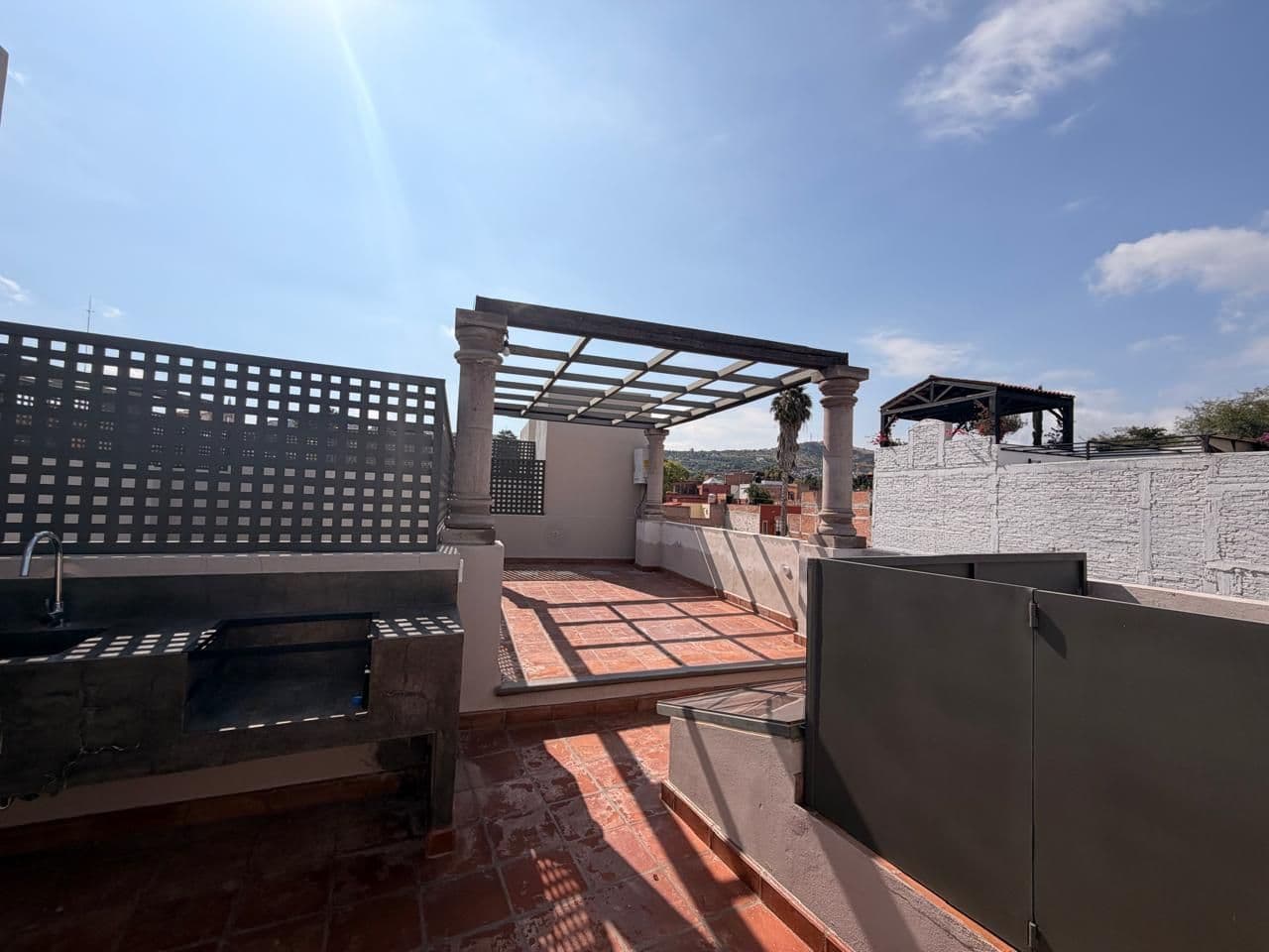 CASA VEINTIOCHO DE ABRIL — San Antonio, San Miguel de Allende — photo 7 — sun-drenched rooftop terrace with panoramic views