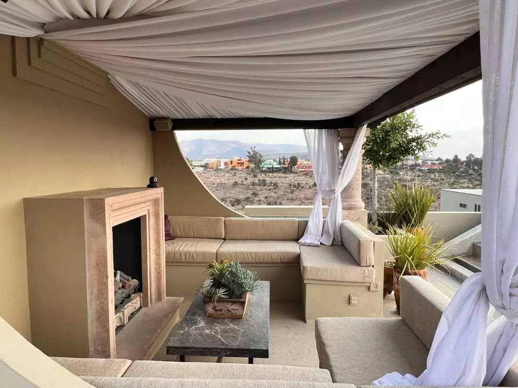 Casa Lyla — Balcones, San Miguel de Allende — photo 2 — panoramic terrace with fireplace elegance