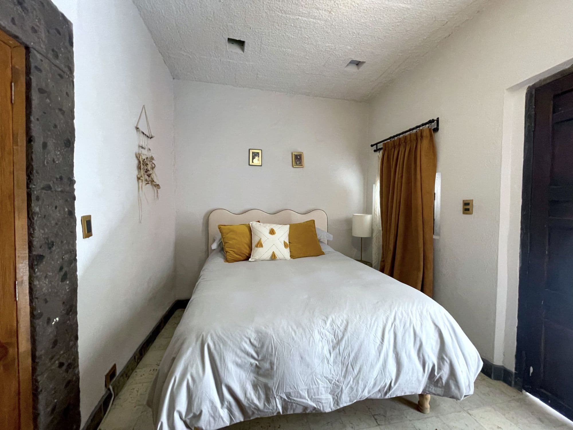 Casa Correo — San Miguel de Allende Centro, San Miguel de Allende — photo 15 — serene bedroom, golden light, rustic charm