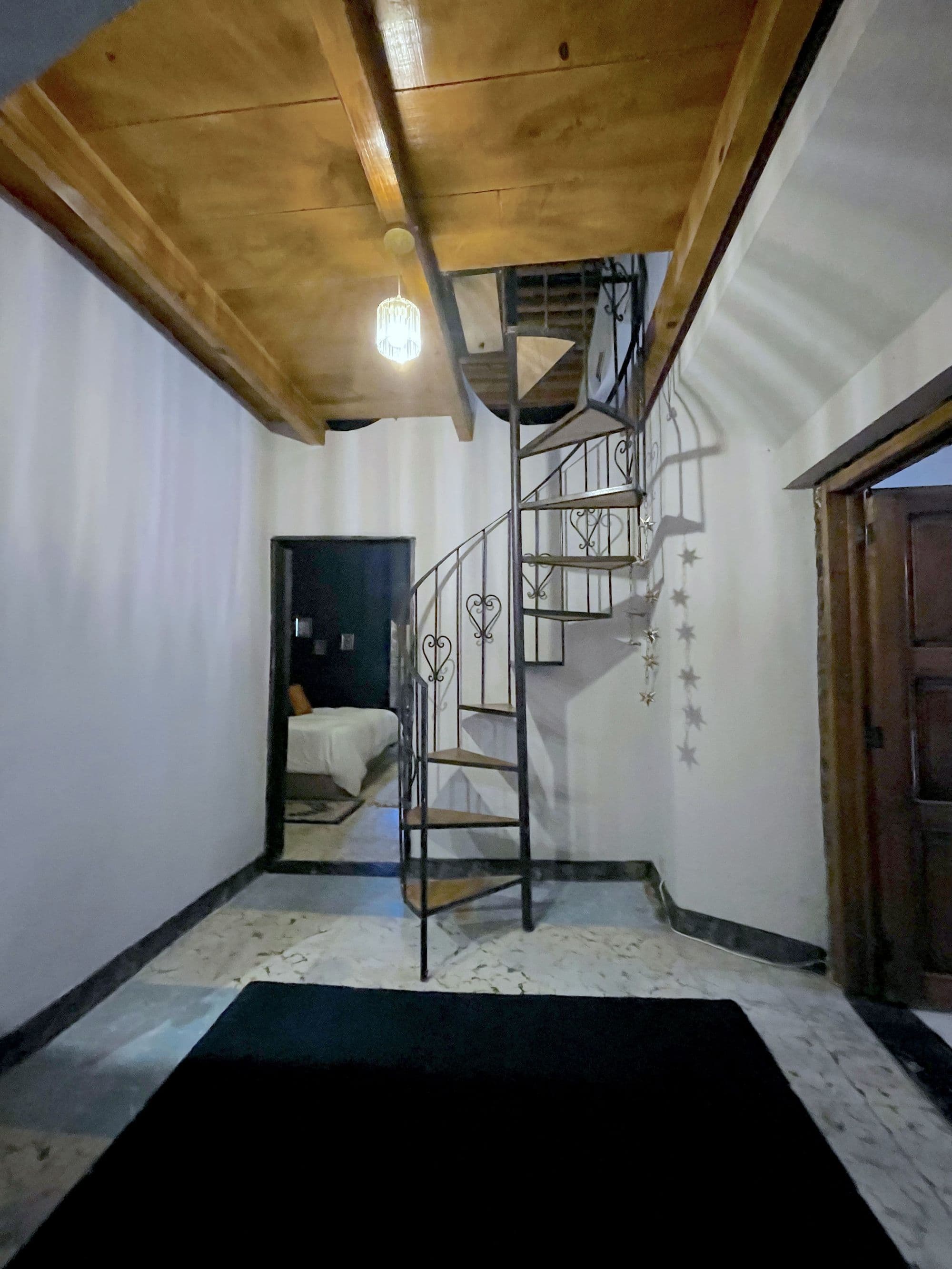 Casa Correo — San Miguel de Allende Centro, San Miguel de Allende — photo 10 — charming spiral staircase, rustic wooden beams