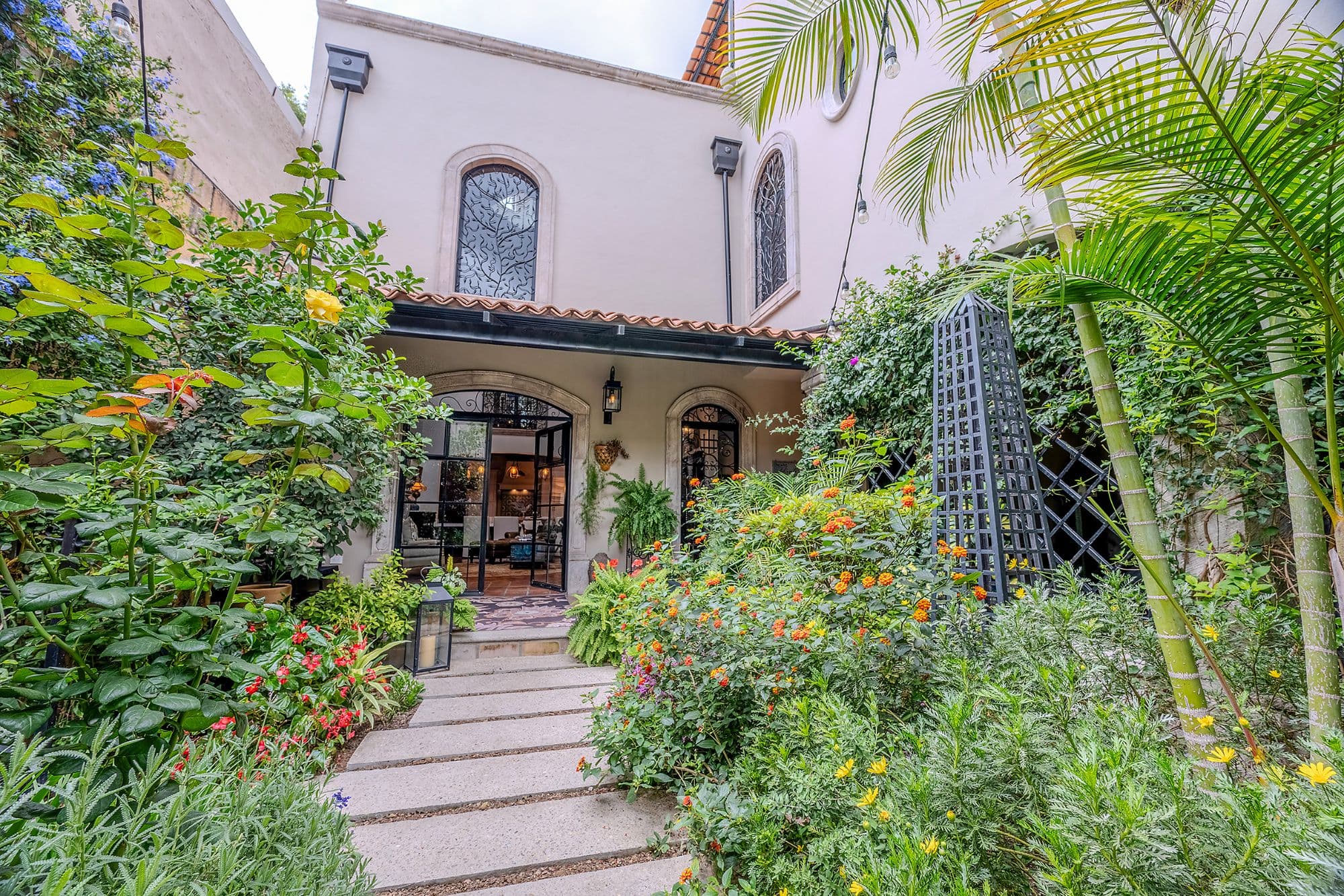 Casa de los Leones — Guadalupe, San Miguel de Allende — photo 3 — lush garden courtyard, charming colonial entry