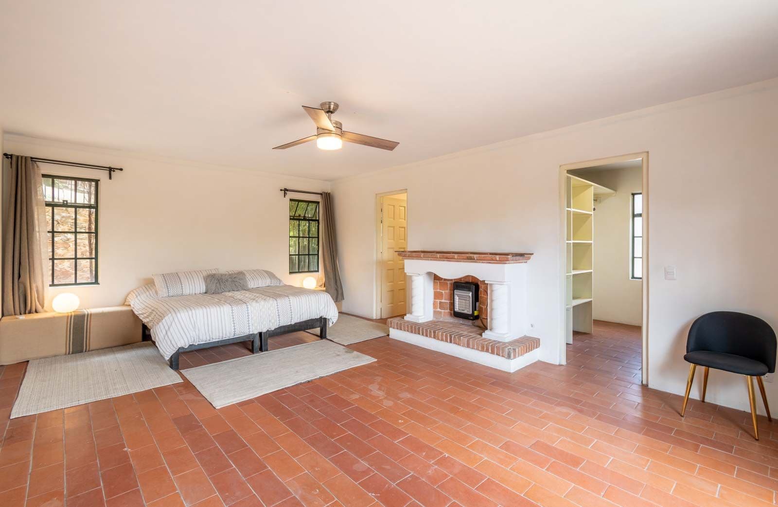 Santo Domingo Condo 9C — Centro, San Miguel de Allende — photo 6 — luminous primary suite with fireplace