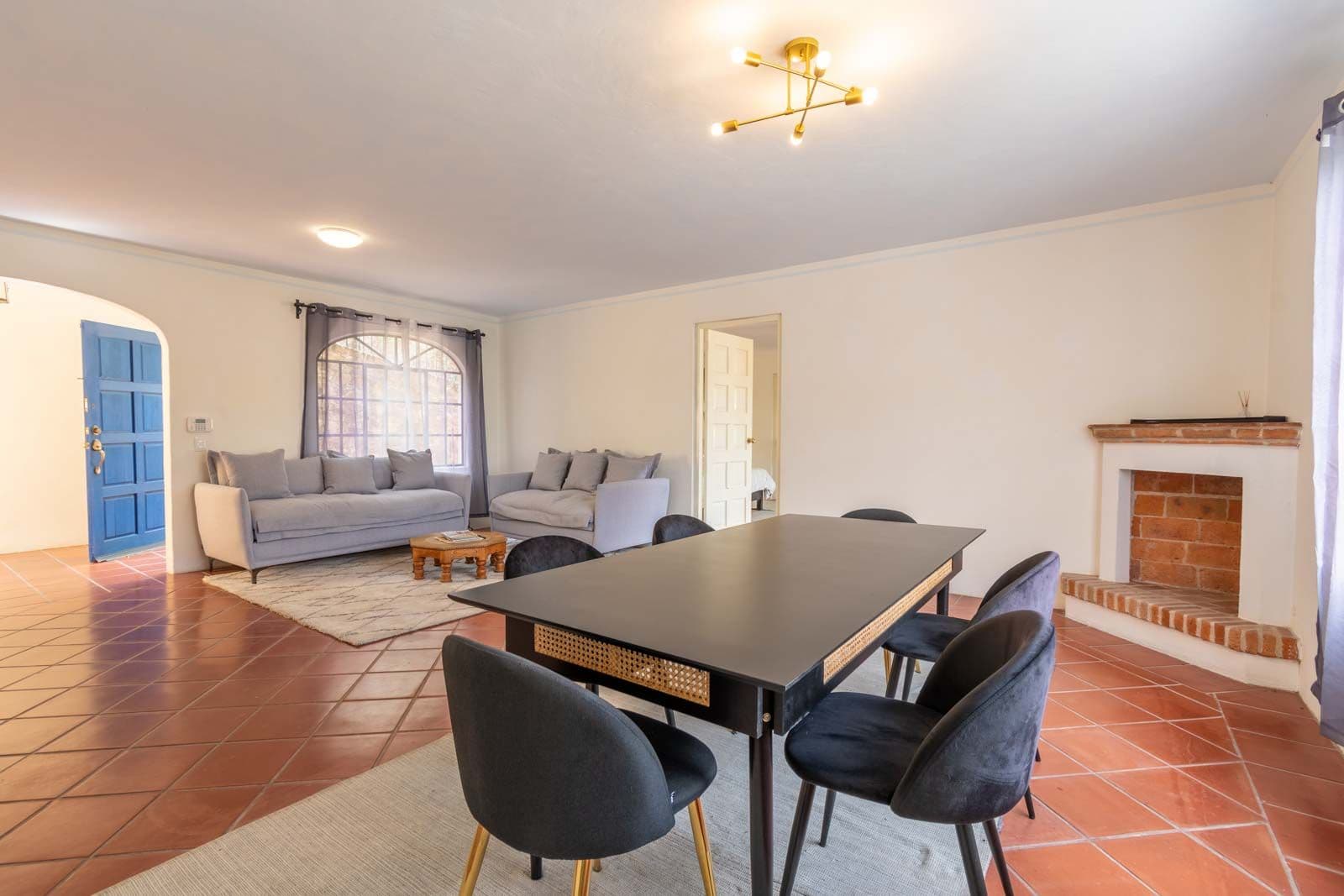 Santo Domingo Condo 9C — Centro, San Miguel de Allende — photo 4 — spacious living room, fireplace, natural light