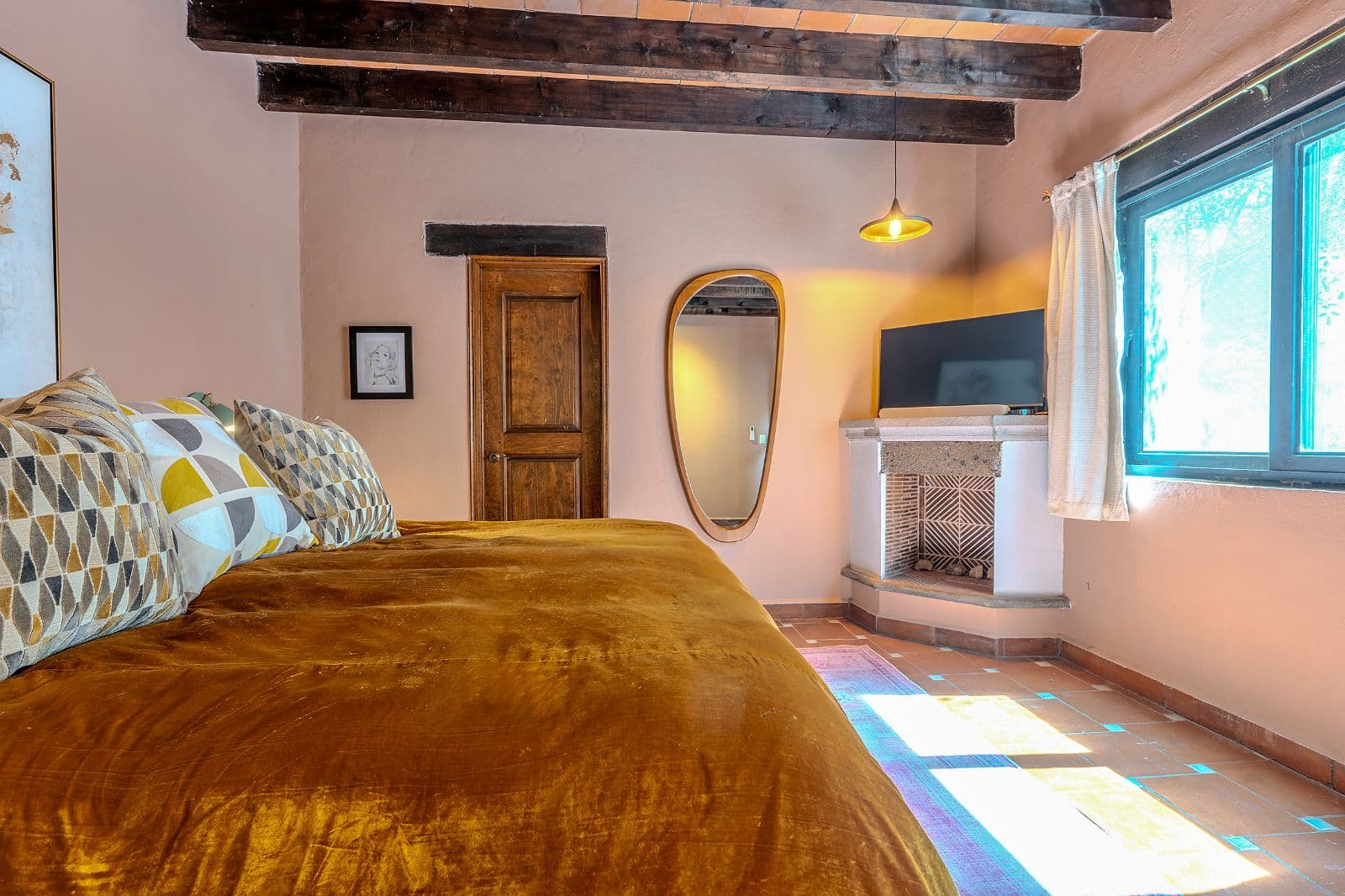 Casa Blue — La Palmita, San Miguel de Allende — photo 11 — sun-drenched bedroom with rustic charm